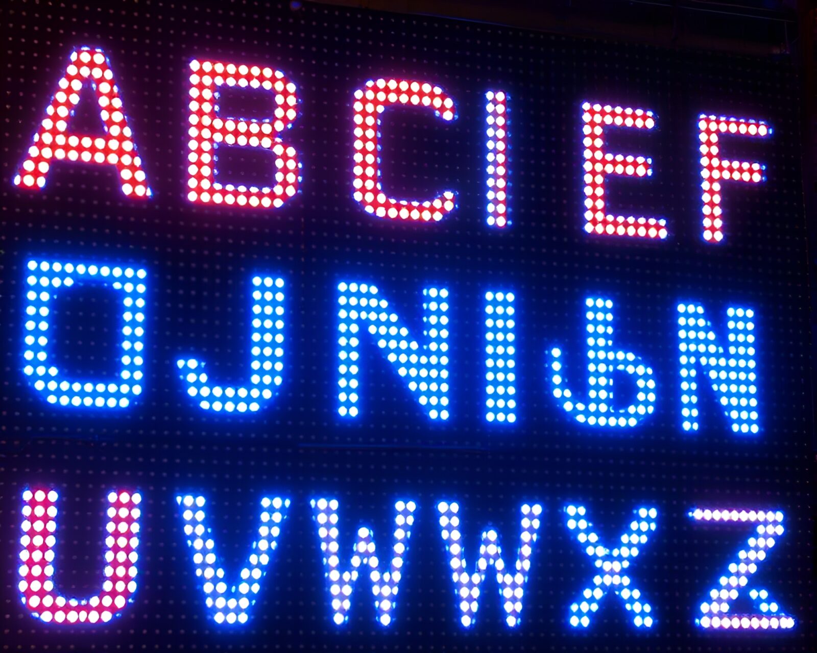 Vibrant mural of runic symbols on LED pixel background