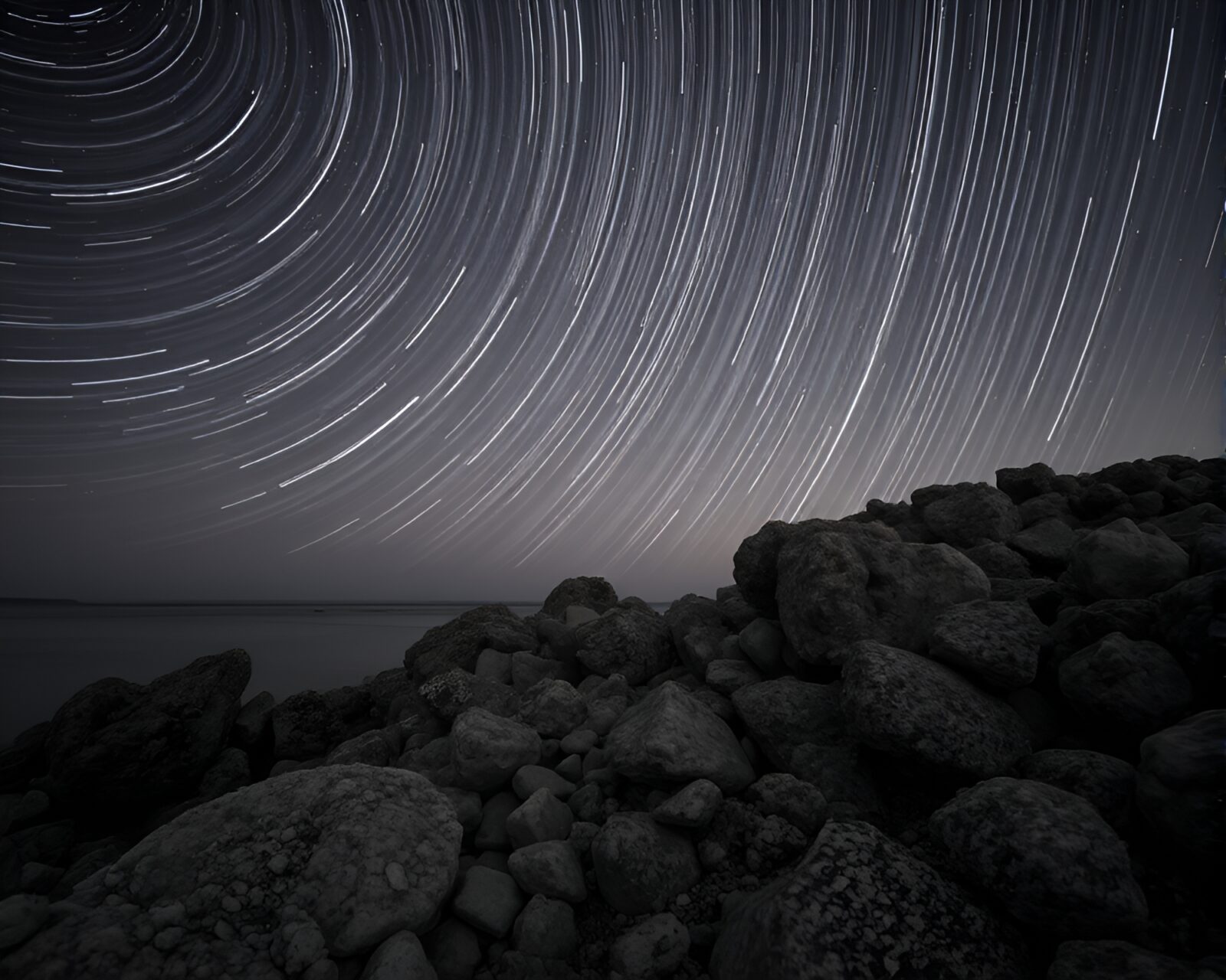 Thermal image of star trails above mystical reef in sepia