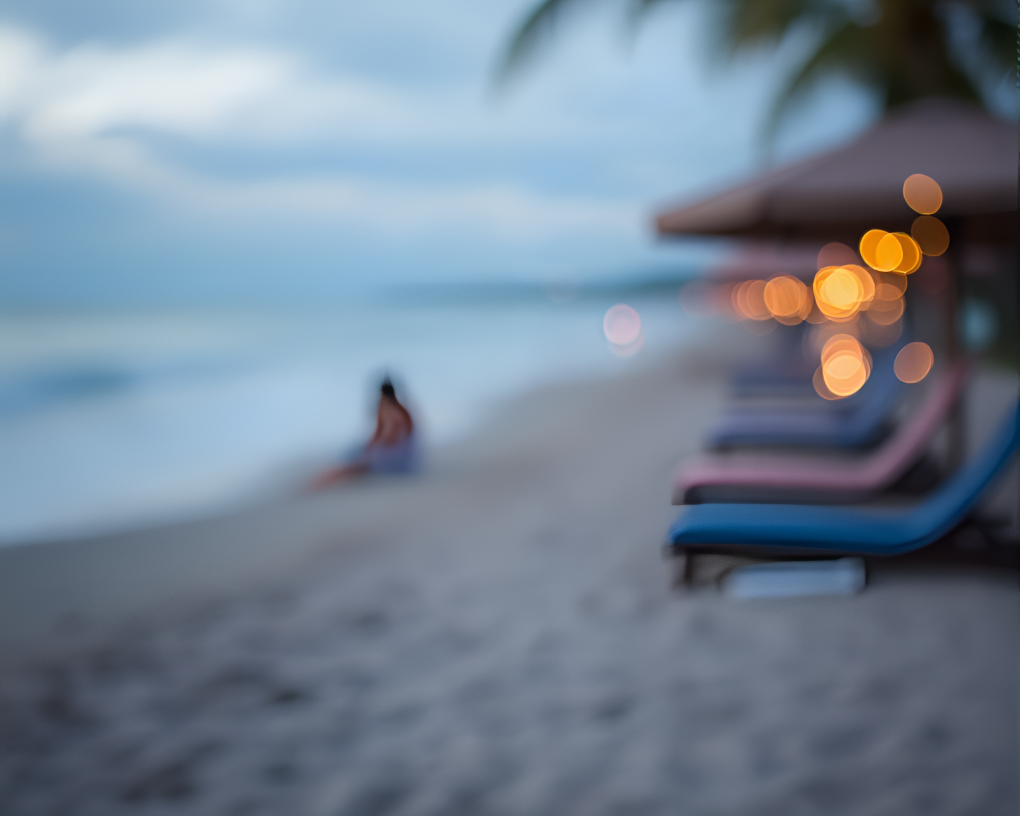 Serene Beach Sunset with Bokeh Lights – free AI stock image