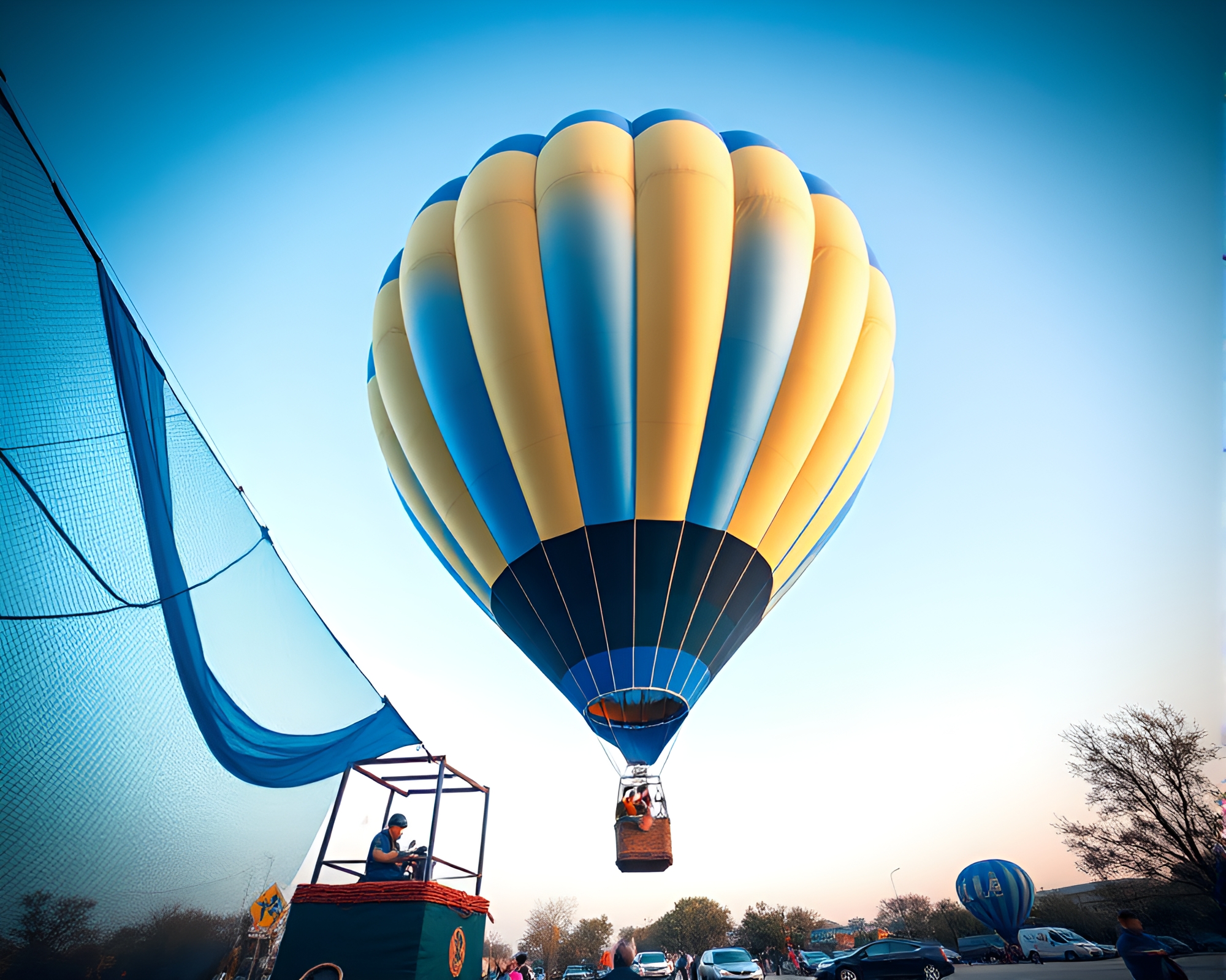 Cobalt Blue Hot Air Balloon Soaring Over Colorful Landscape – free AI stock image