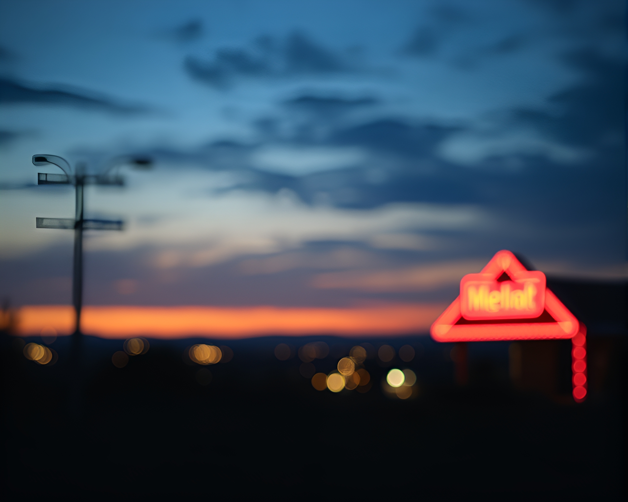 Twilight Blue Neon Sign Bokeh Landscape – free AI stock image