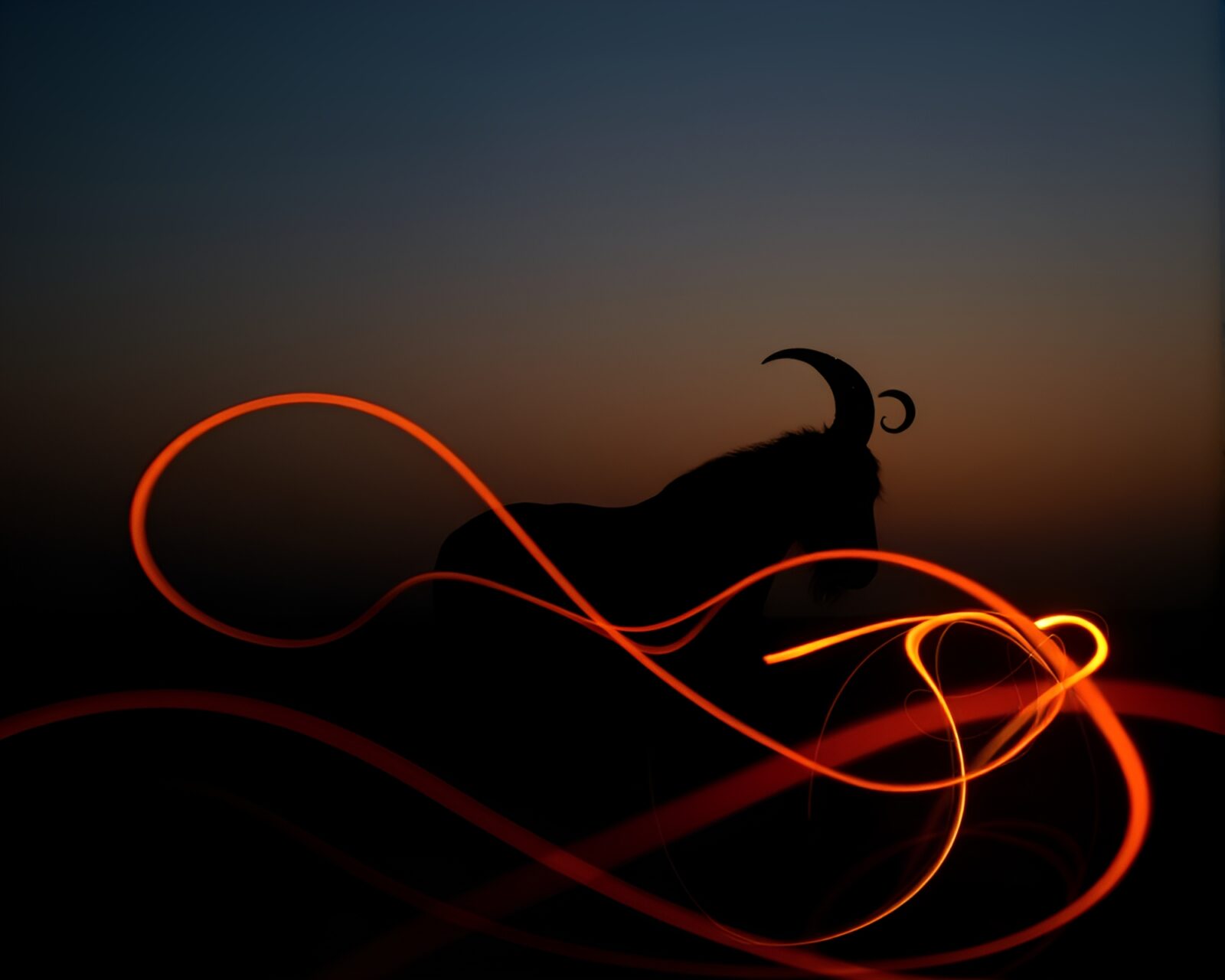 Backlit silhouette of satyr surrounded by peachy light trails