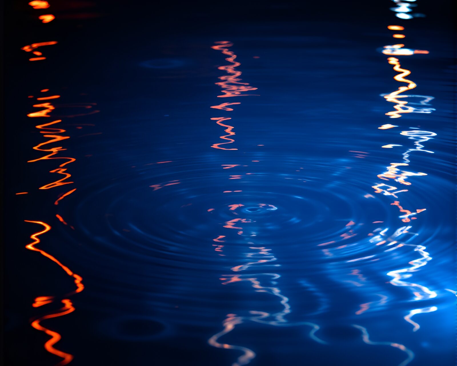 Colorful underwater scene with LED lights and ripple reflections