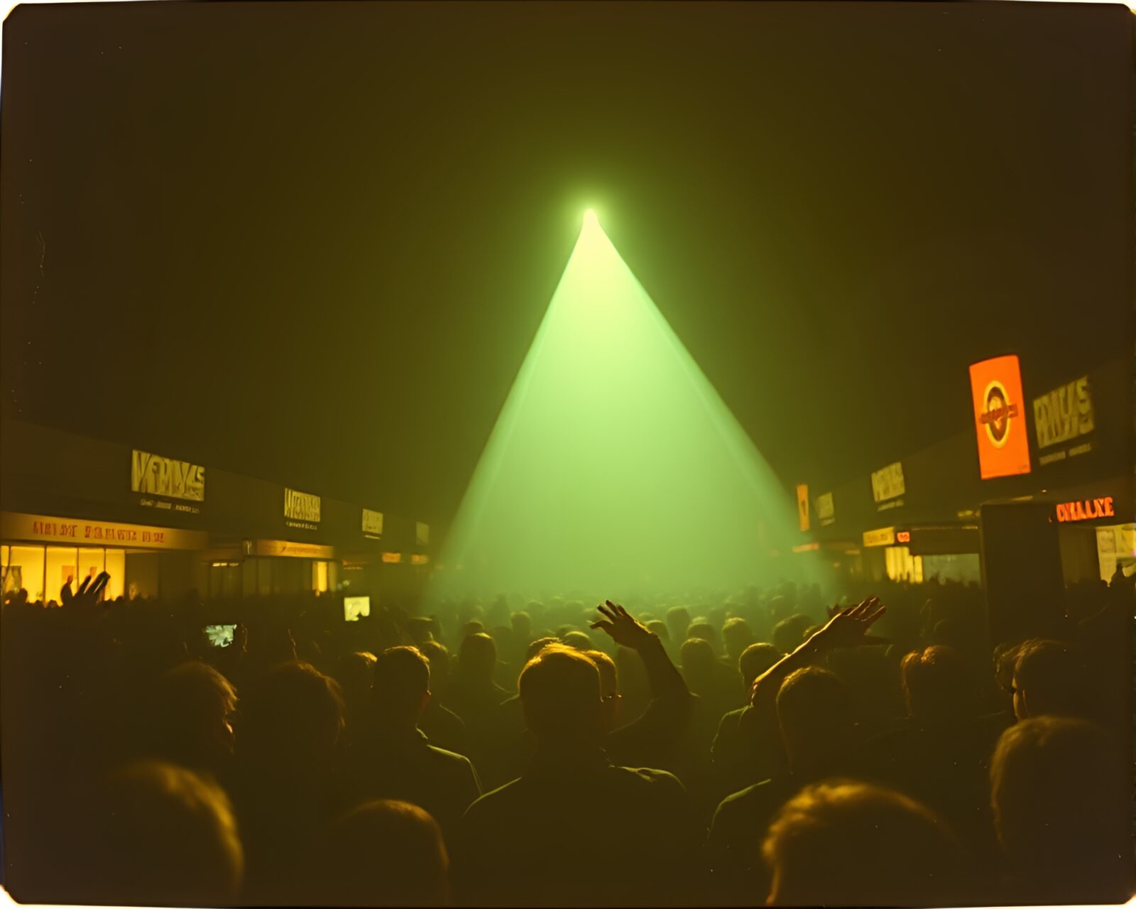 Silhouetted crowd in front of glowing wormhole generator