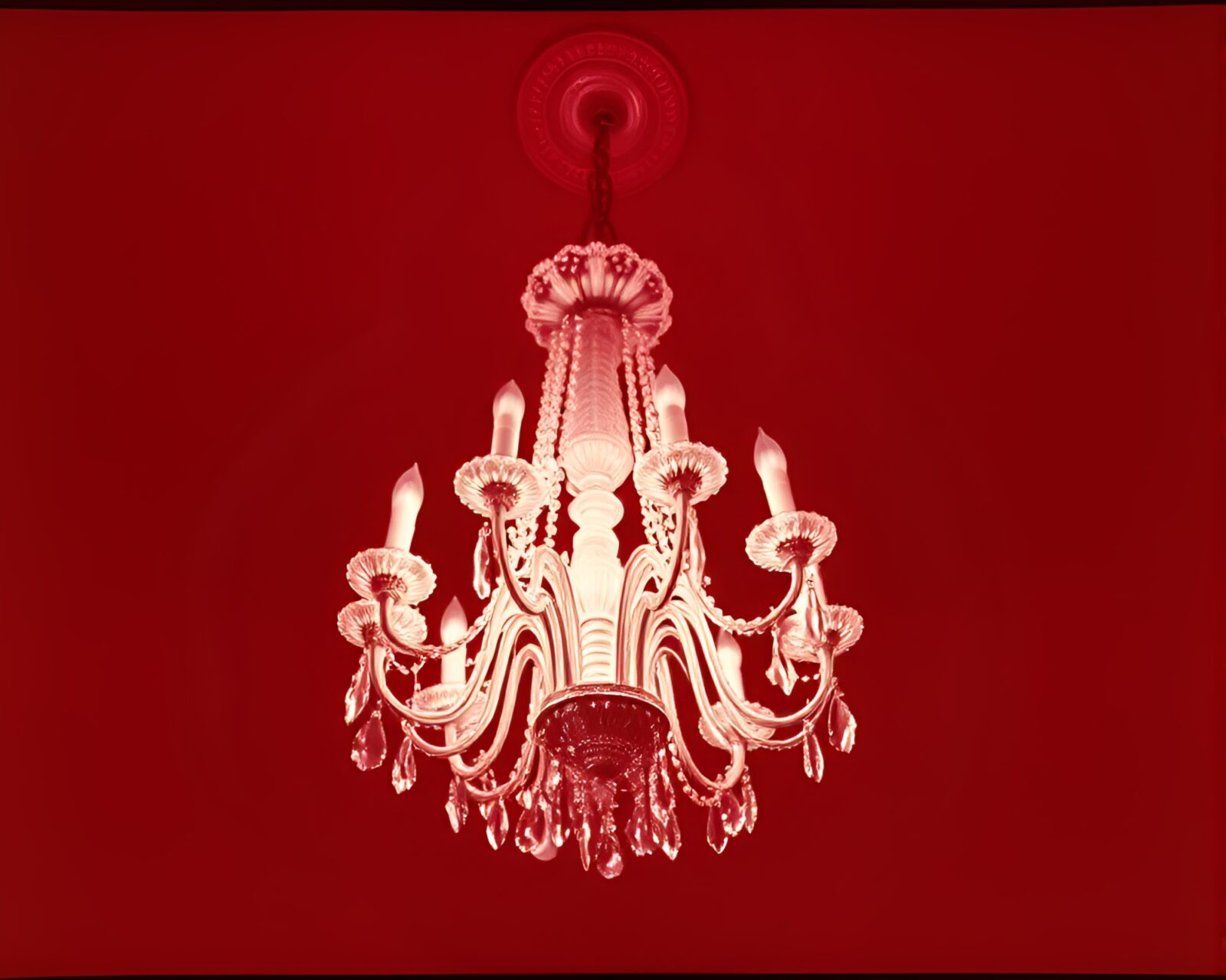 Surreal infrared photo of ornate Victorian chandelier at a tilt