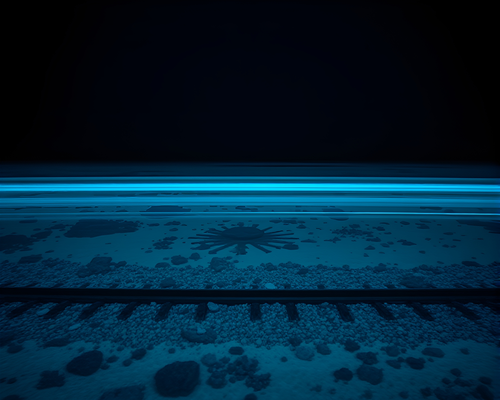 Steel-Blue Coral Atoll Train Light Trails – free AI stock image