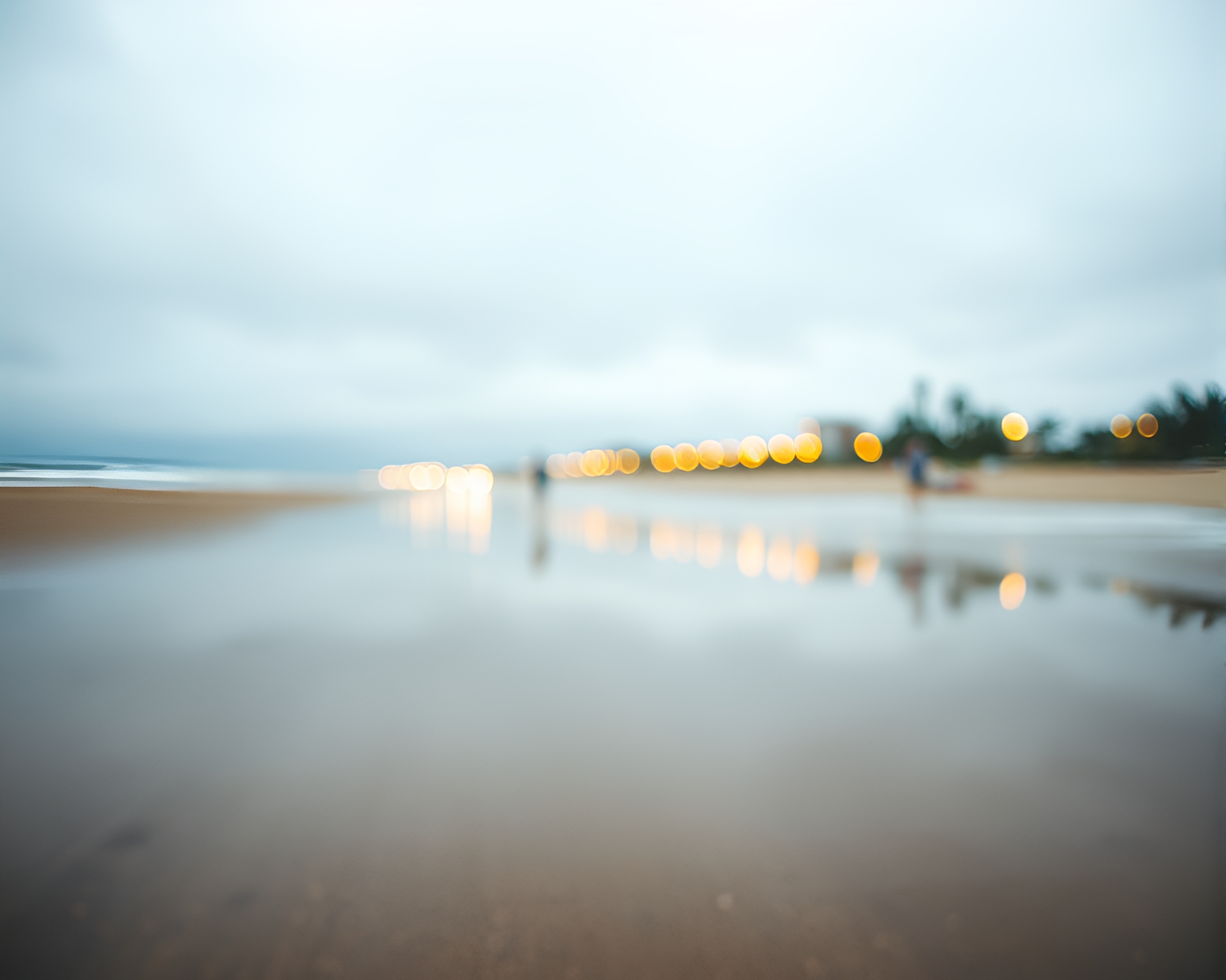 Rainy Beach Reflections in Miniature – free AI stock image