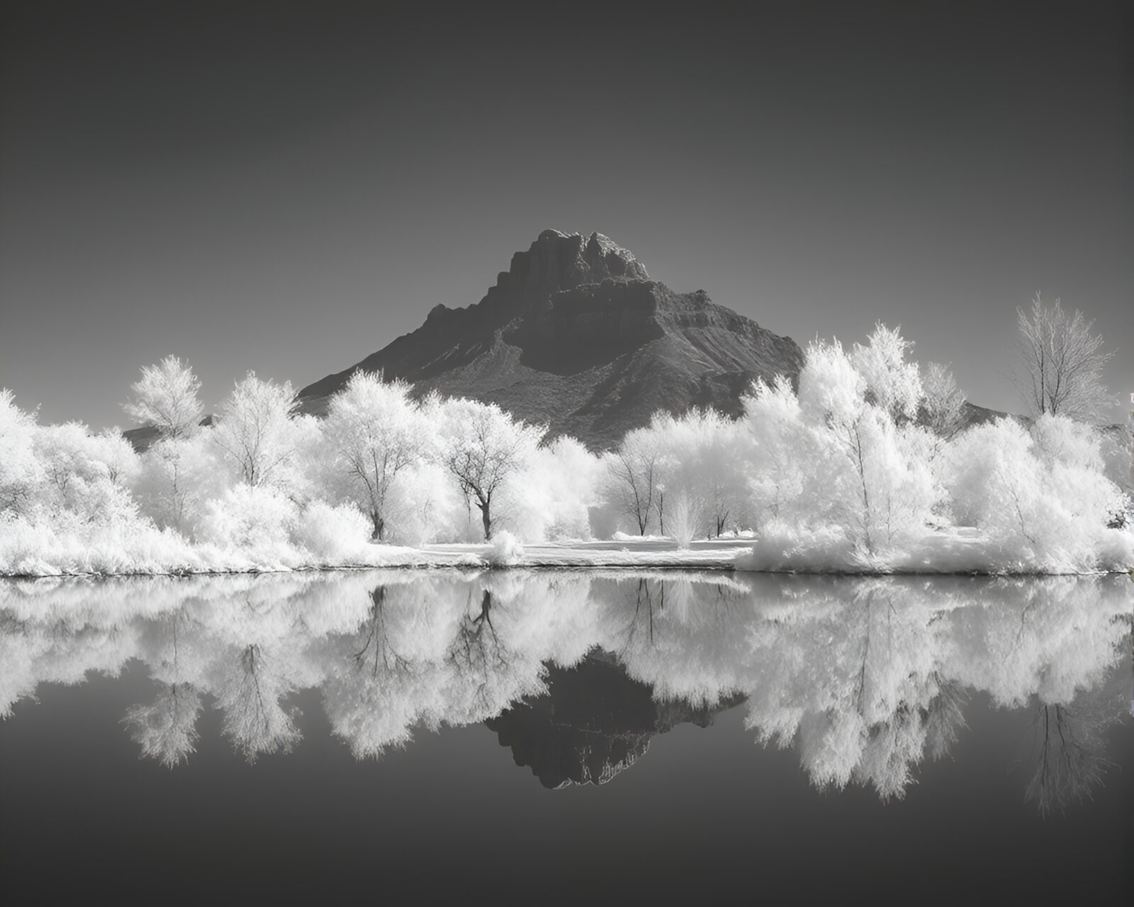 Infrared photo of dwarf figure's silhouette reflecting in ivory white light