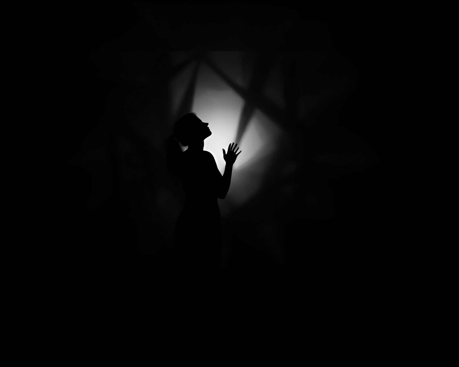 Hatch style artwork of a glowing astral silhouette