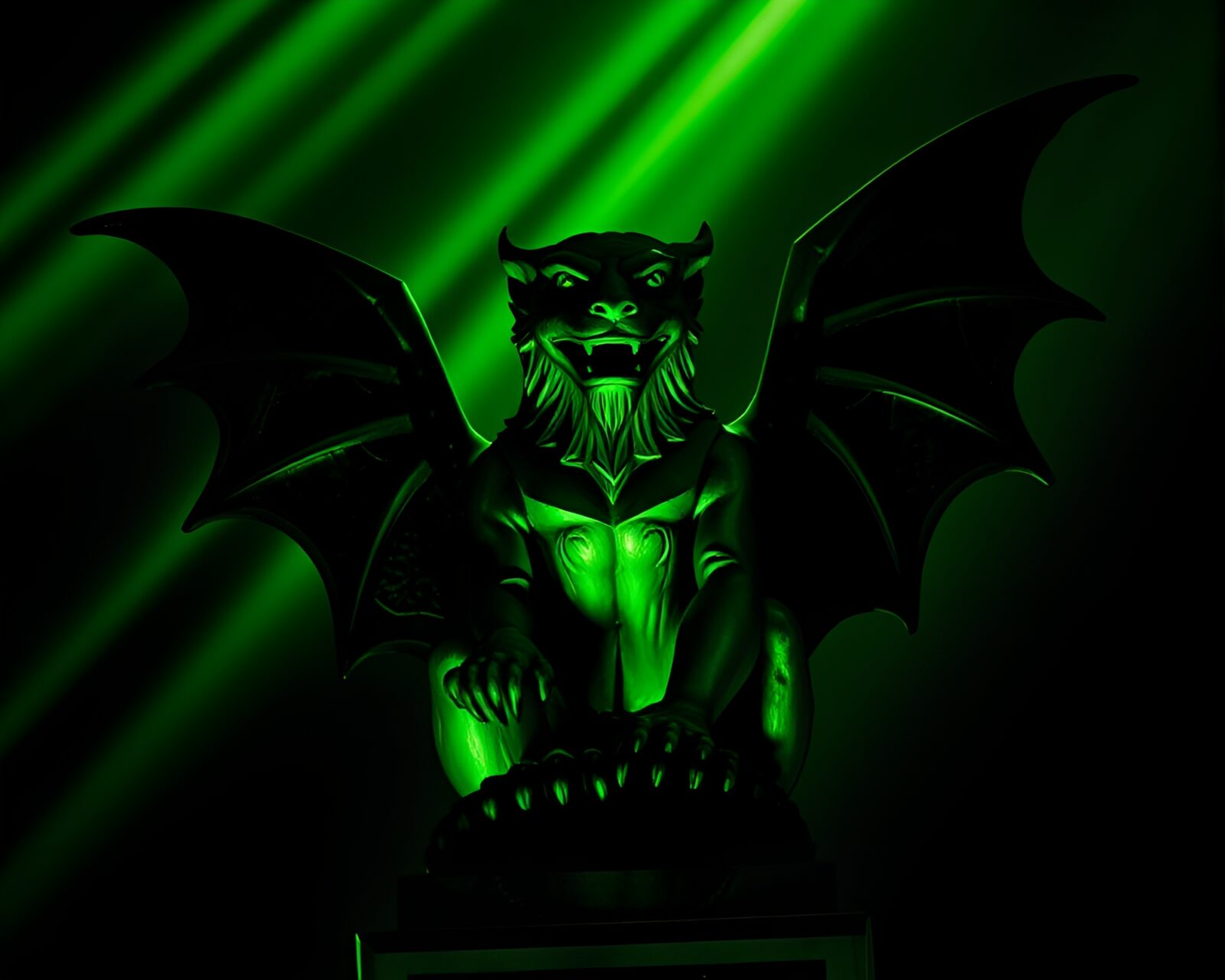 Abstract gargoyle sculpture illuminated in green light leaks