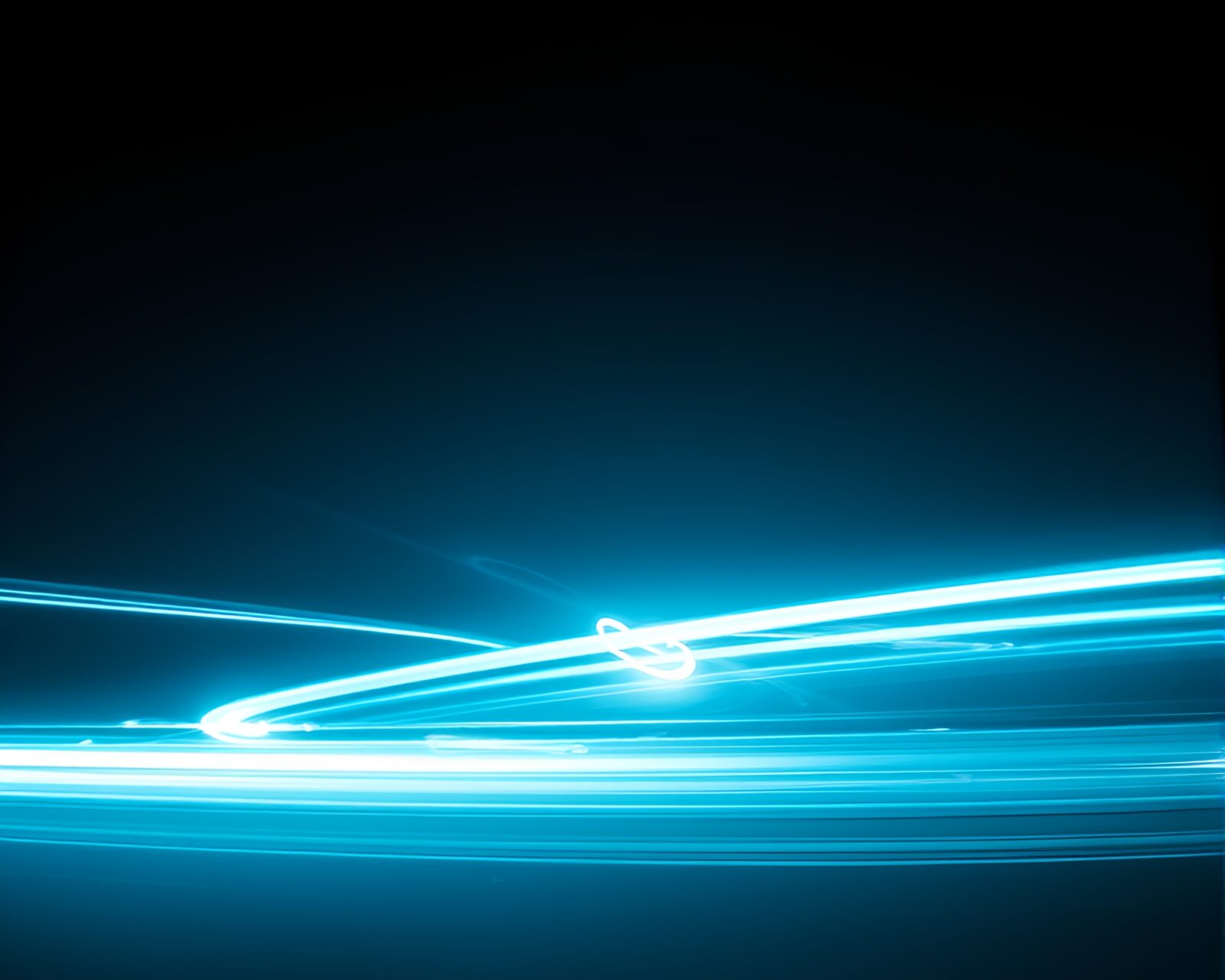 Eerie underwater scene with illuminated submarine and light streaks