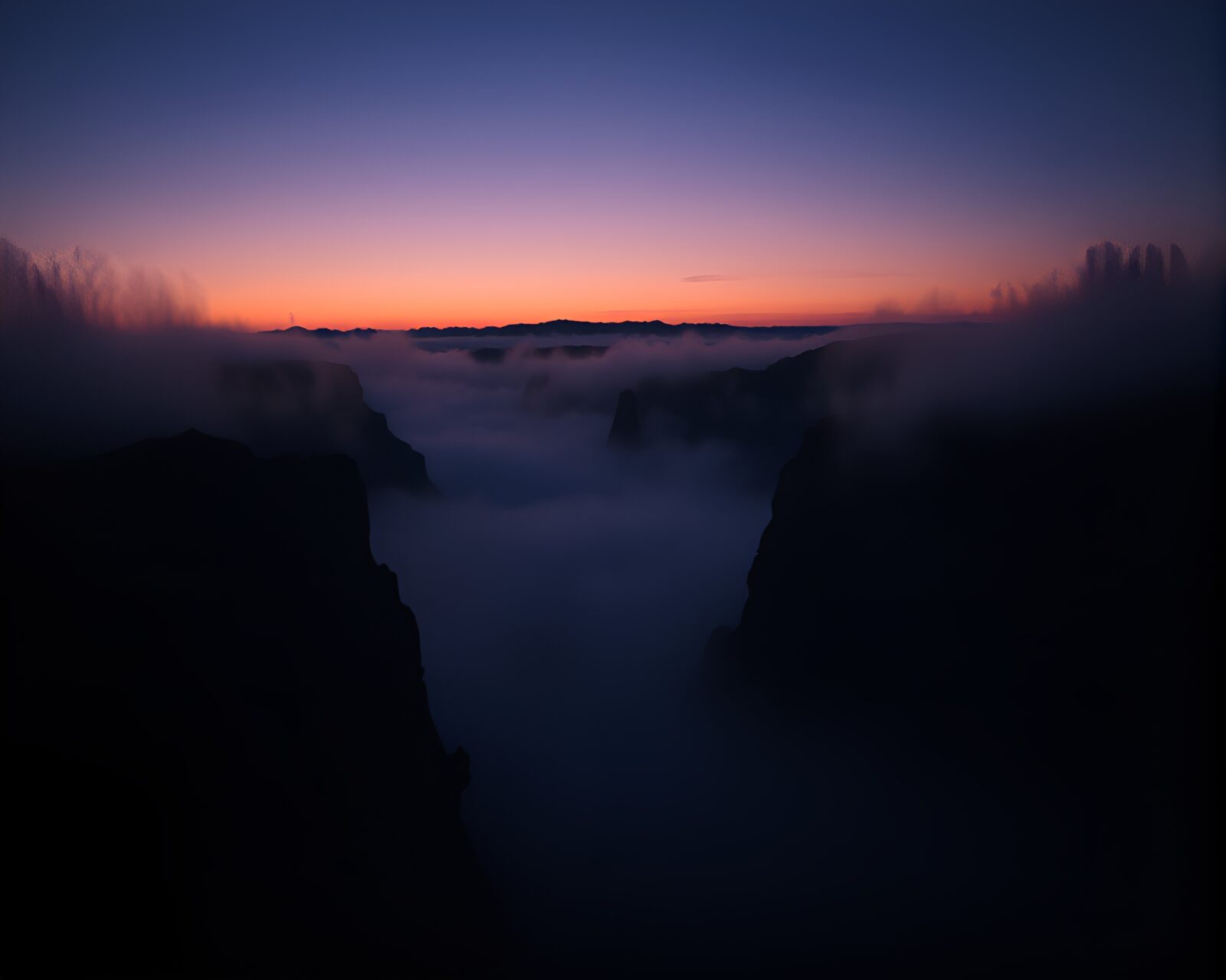 Surreal canyon with fog at twilight, illuminated by chiaroscuro lighting