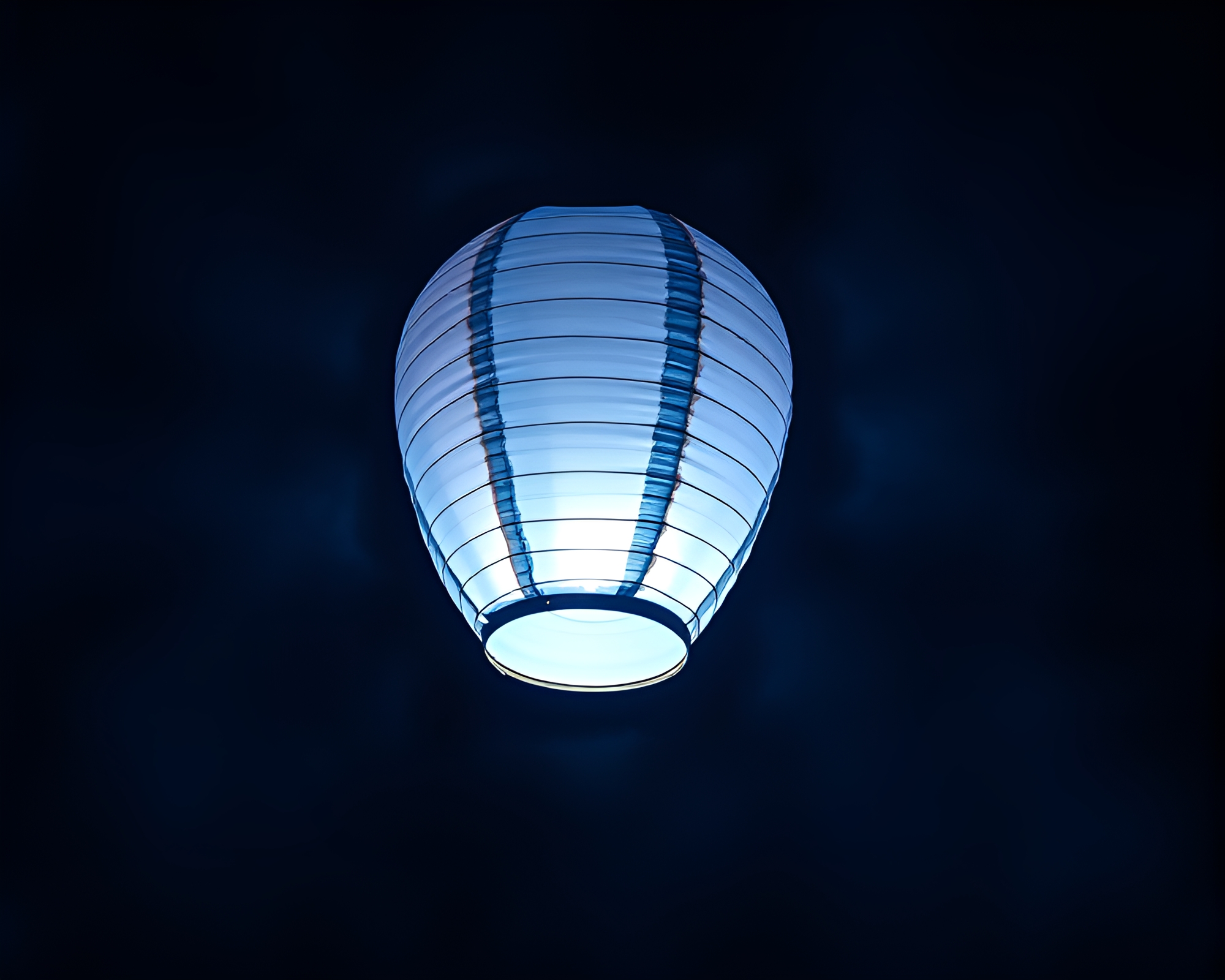 Magical Paper Lantern Illuminated under Starry Blue Hour Sky – free AI stock image
