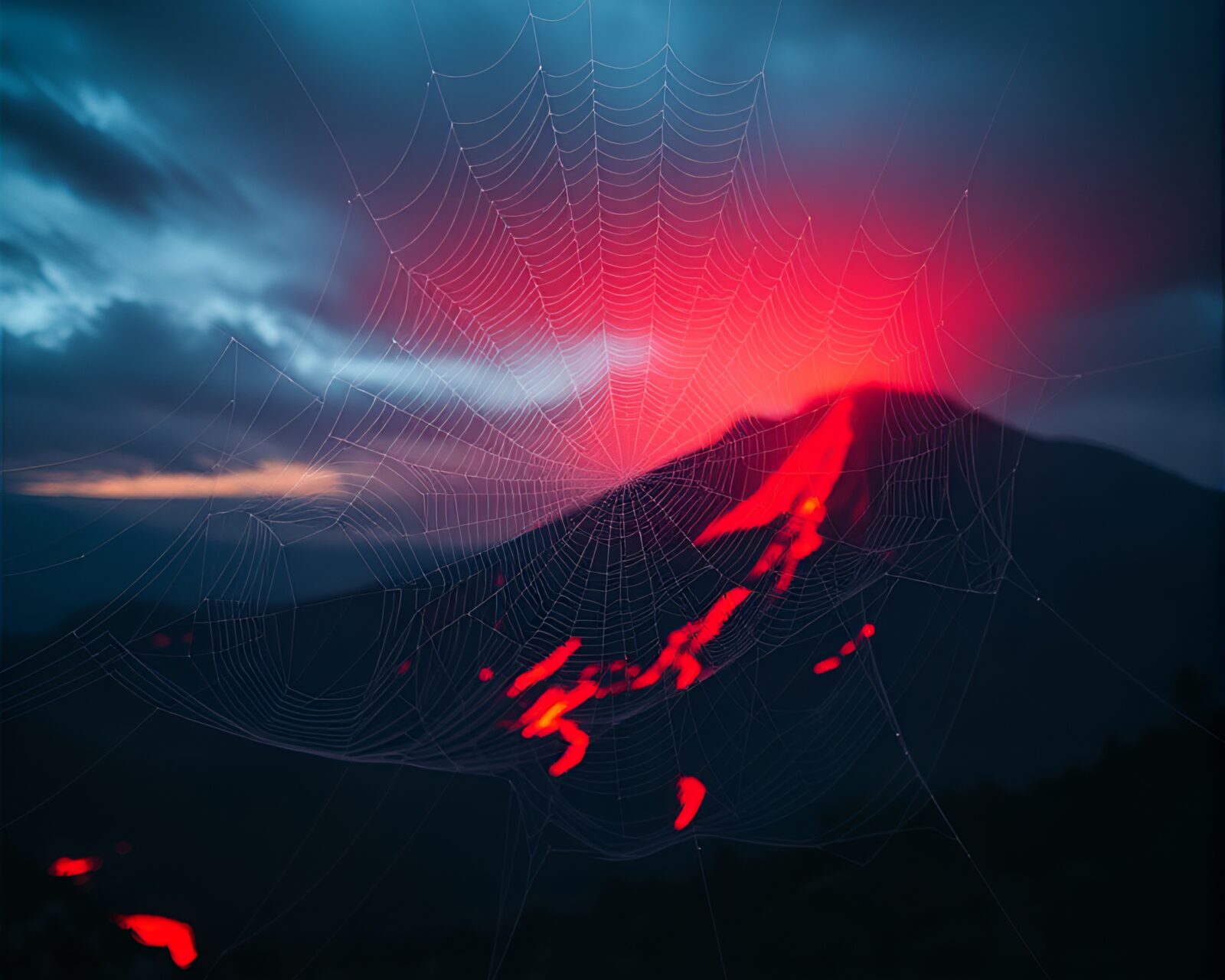 Intricate cobwebs glimmering under red volcanic glow