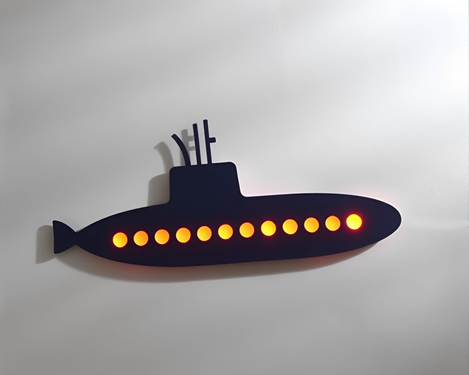 Glowing light trails surrounding vibrant paper cutout submarine