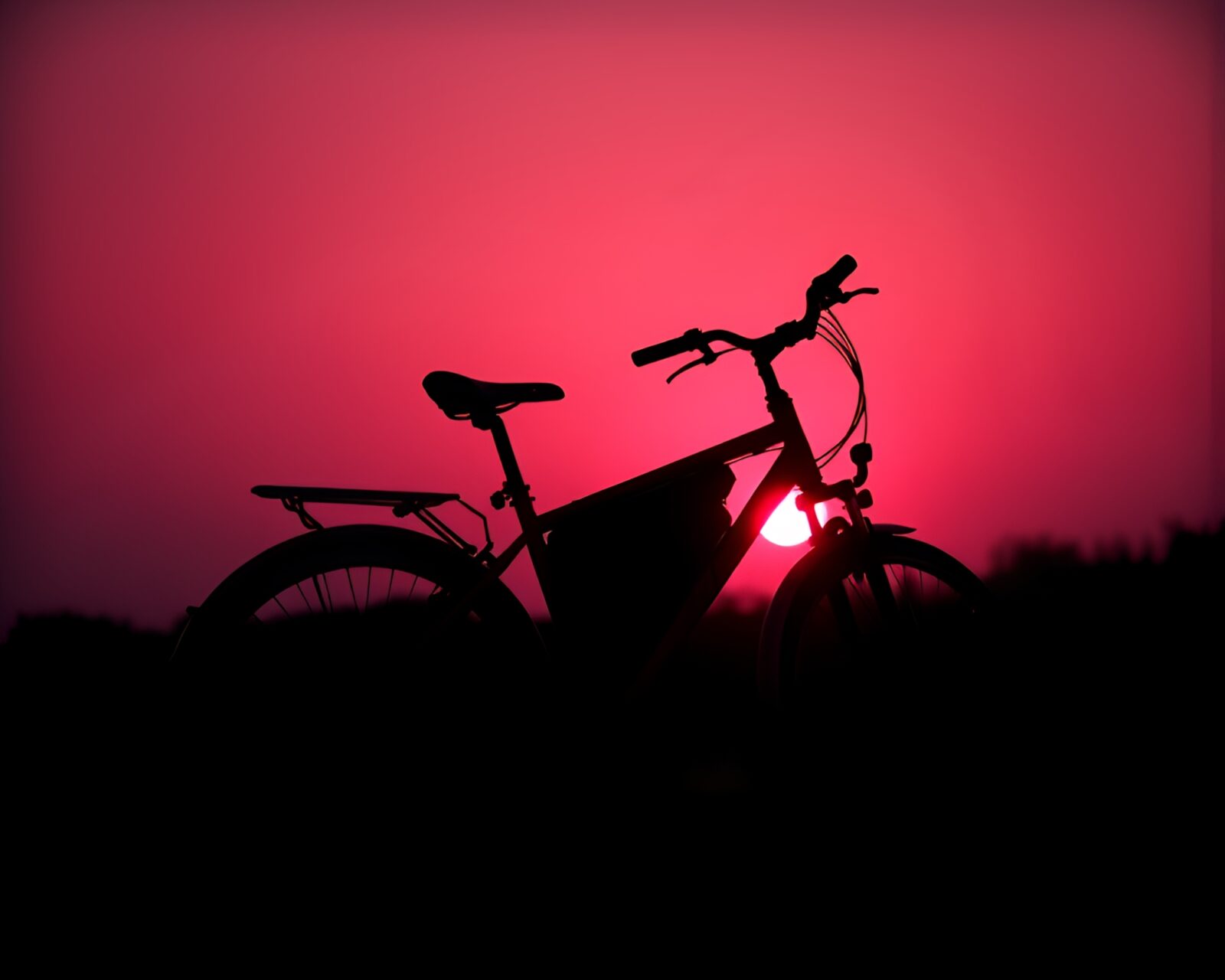 Minimalist sunrise-hued image of a solar-powered bike in duotone style