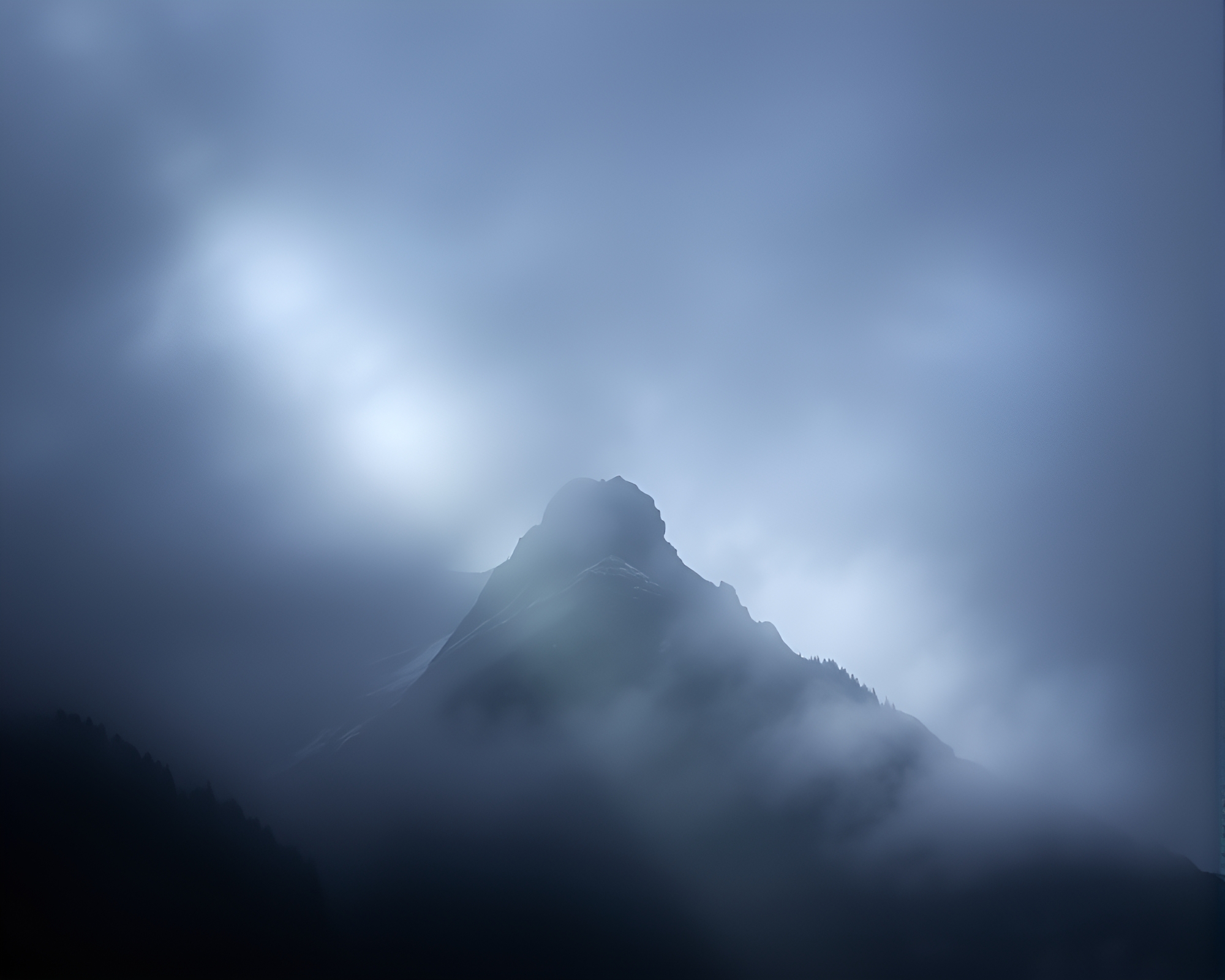 Mist-shrouded Mountain in Theatrical Spotlight with Lens Distortion – free AI stock image