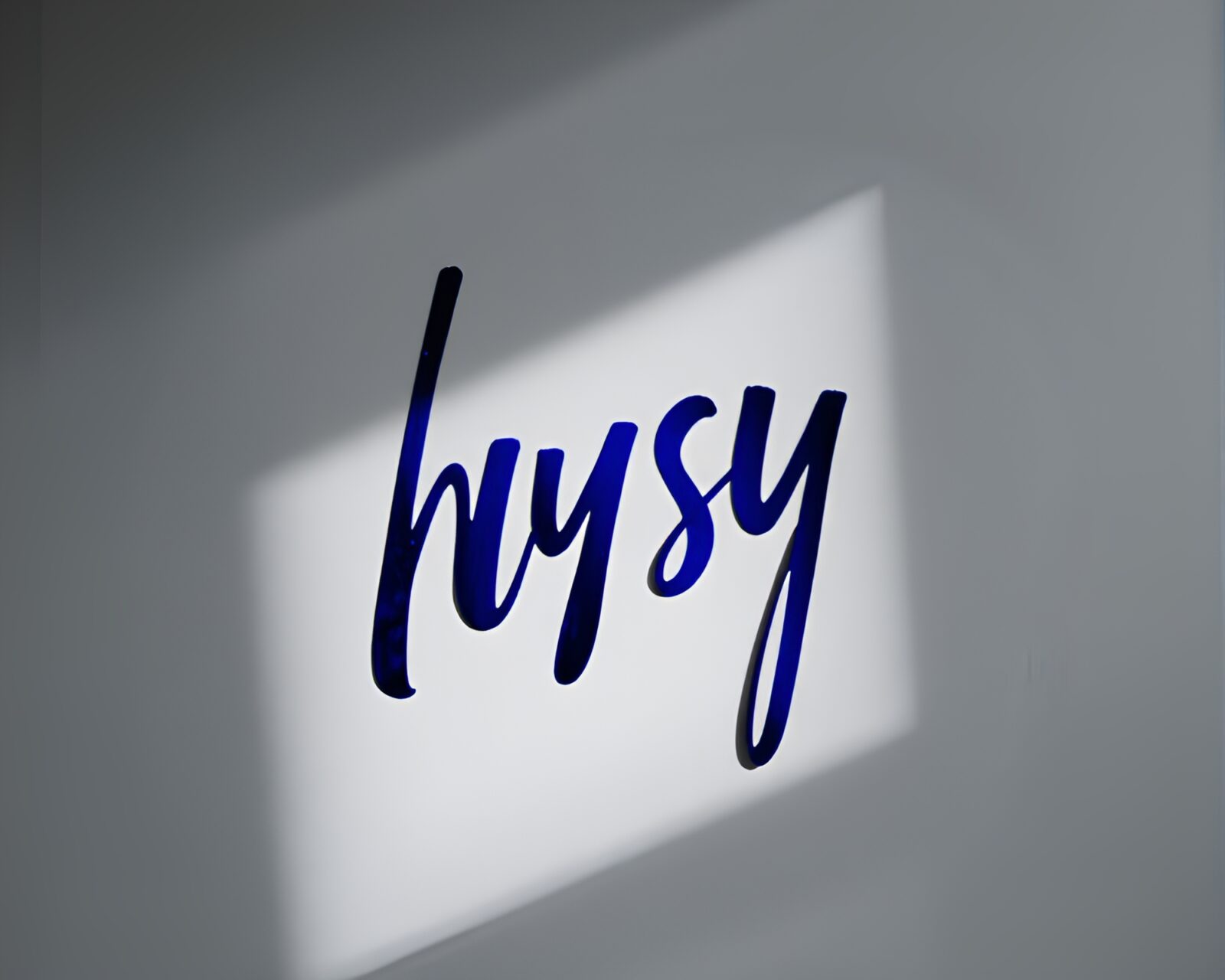 Mysterious indigo scene of handwritten letters reflecting in chrome