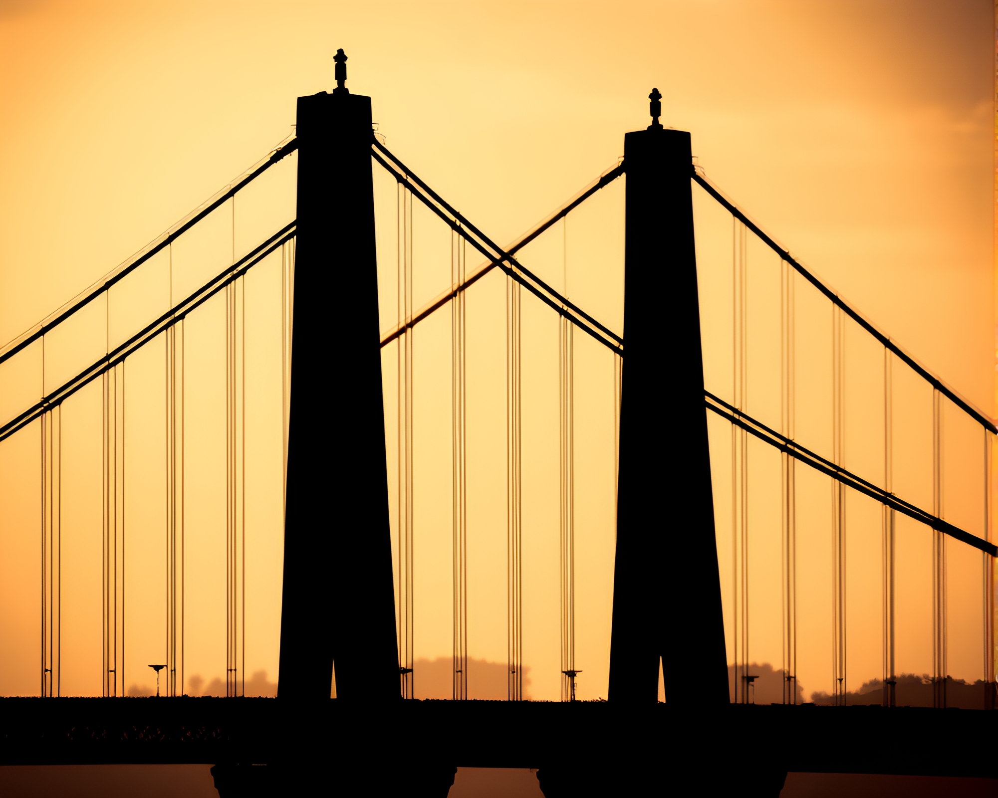 Silhouette of Suspension Bridge in Sepia Bokeh Twilight – free AI stock image