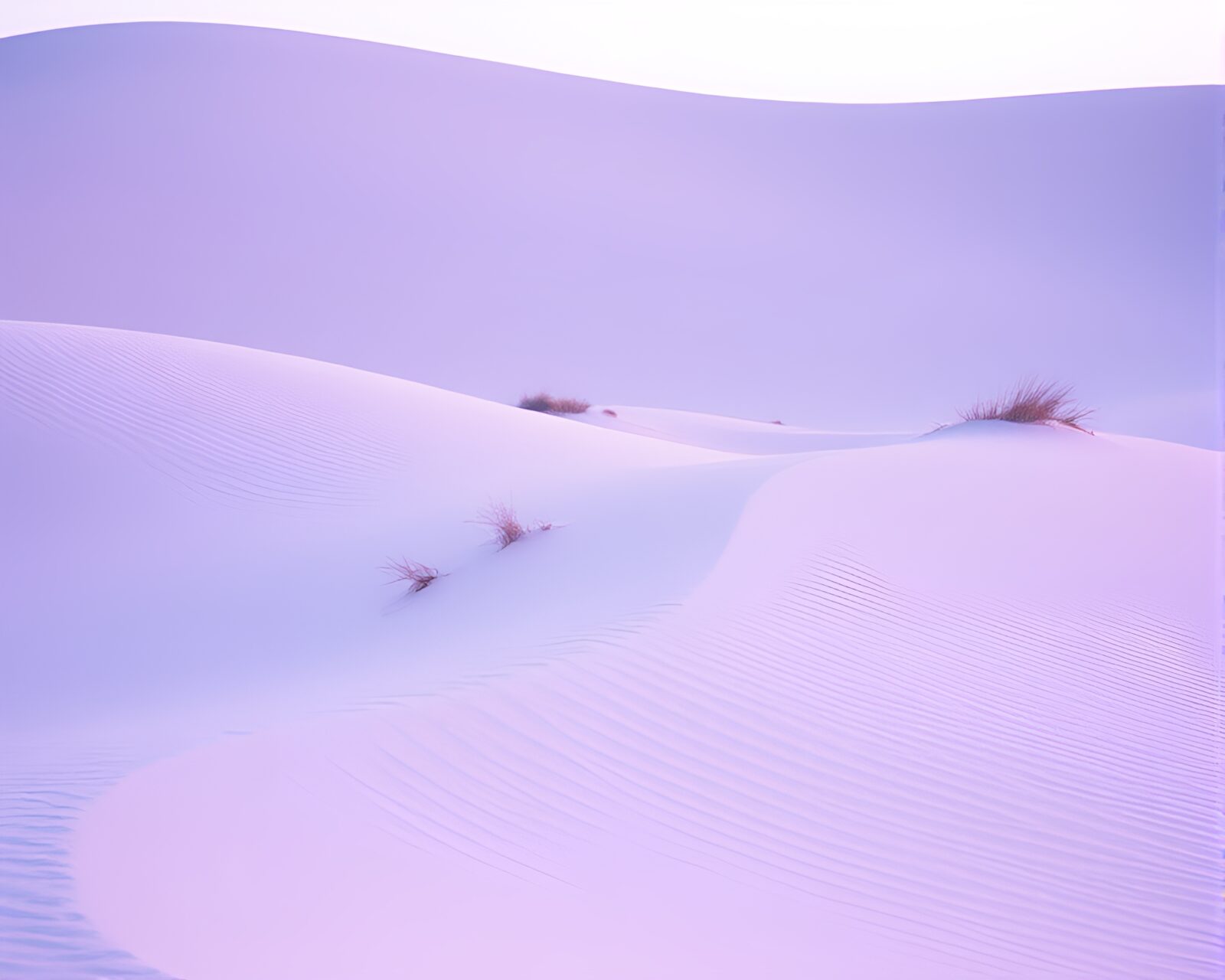 Retro styled image of a burning film over sand dune