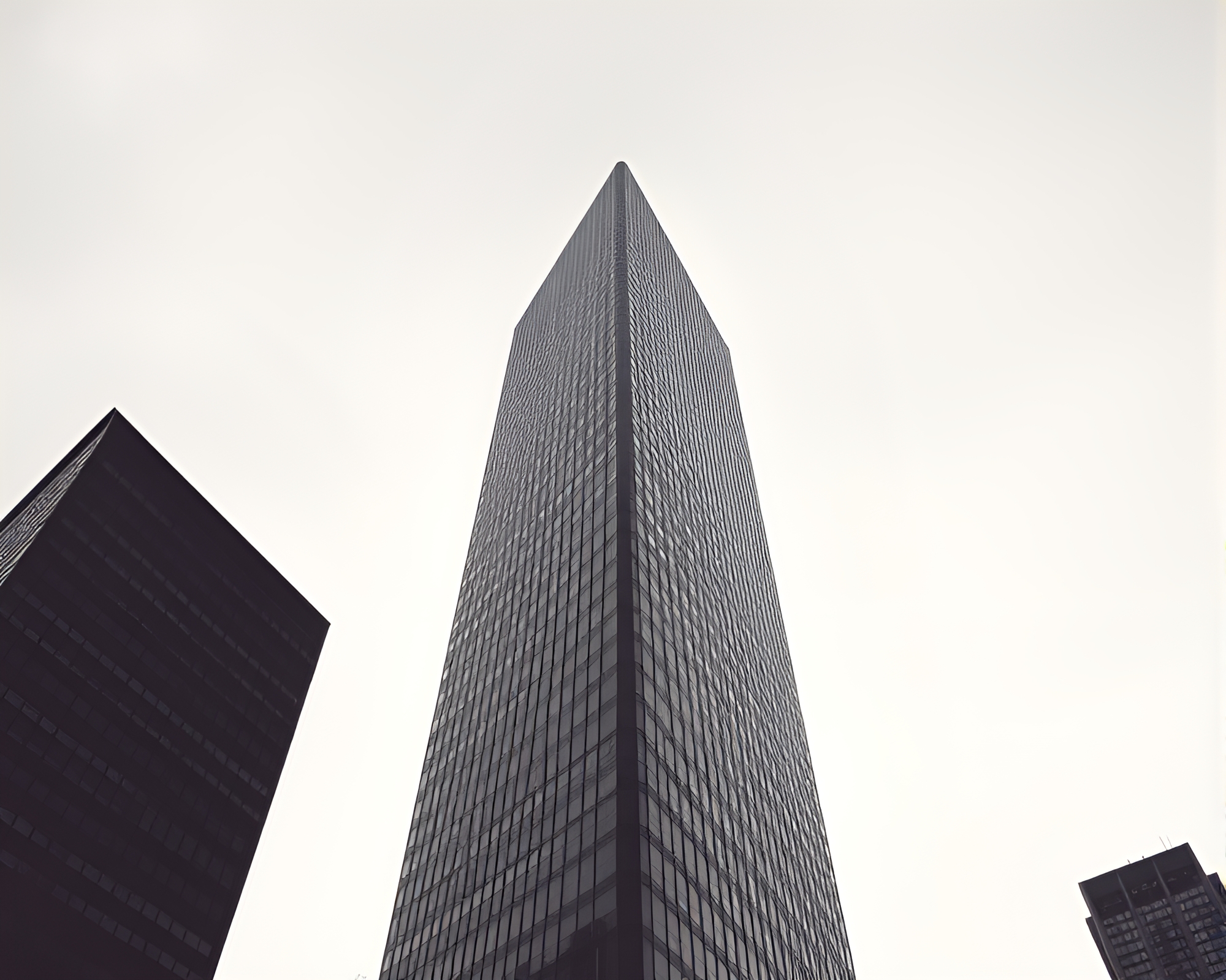 Monochrome Blue Skyscraper: Ephemeral Sepia Impressions – free AI stock image