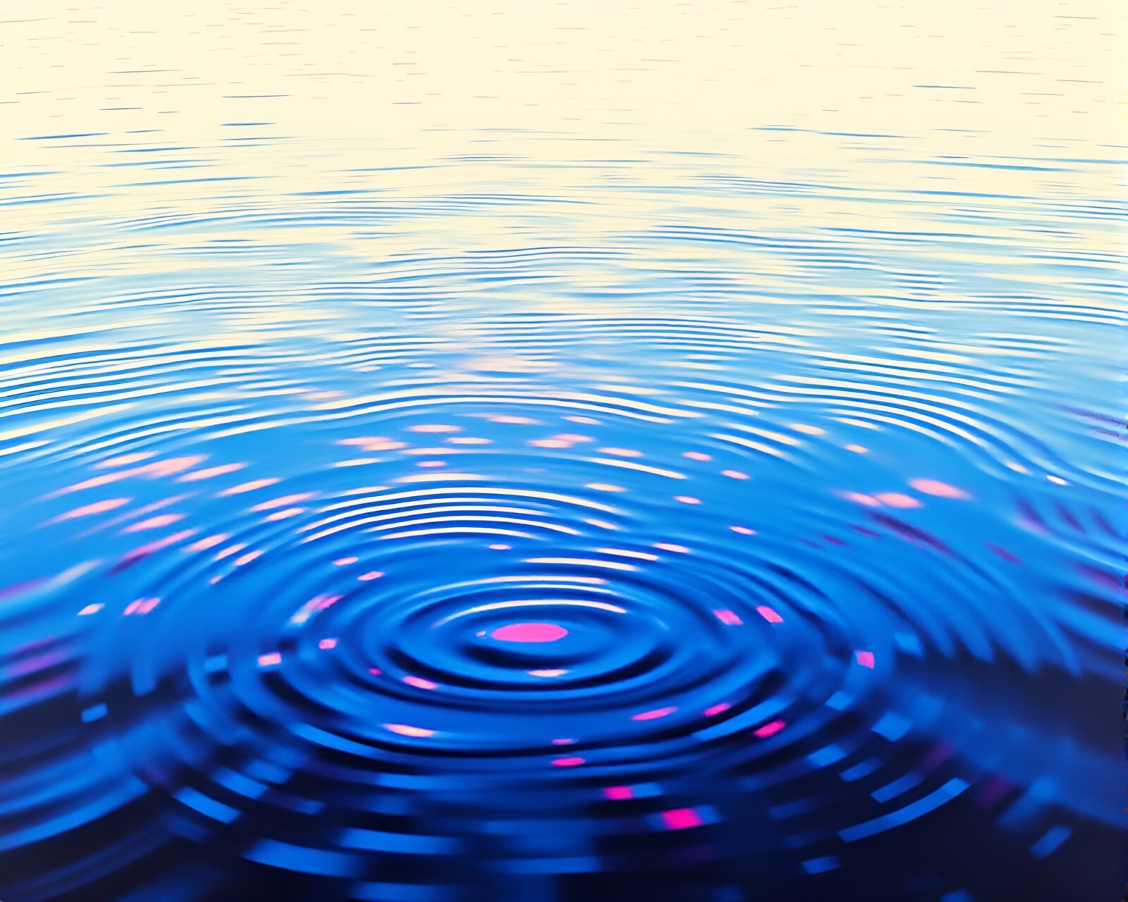 Vibrant color fields on a reflective water surface with ripples