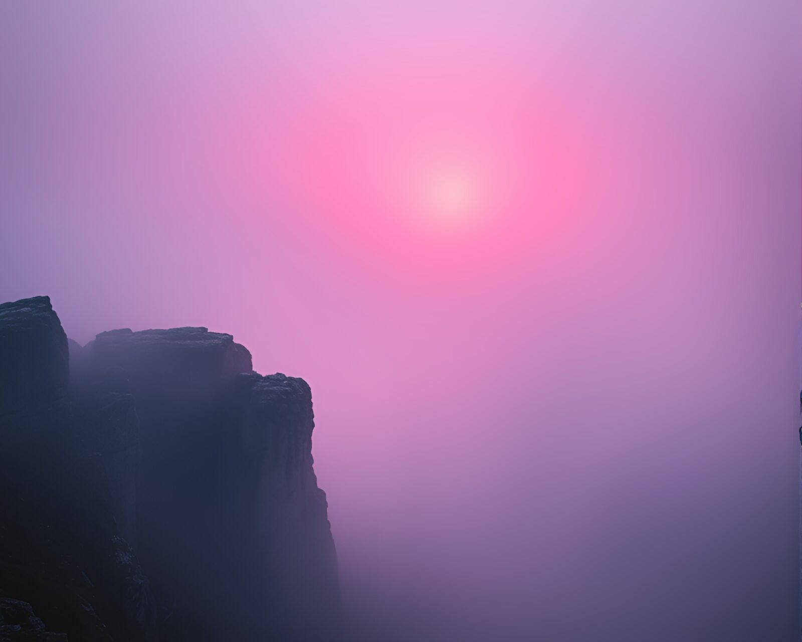 Mystical rune stone glowing in pink misty fog