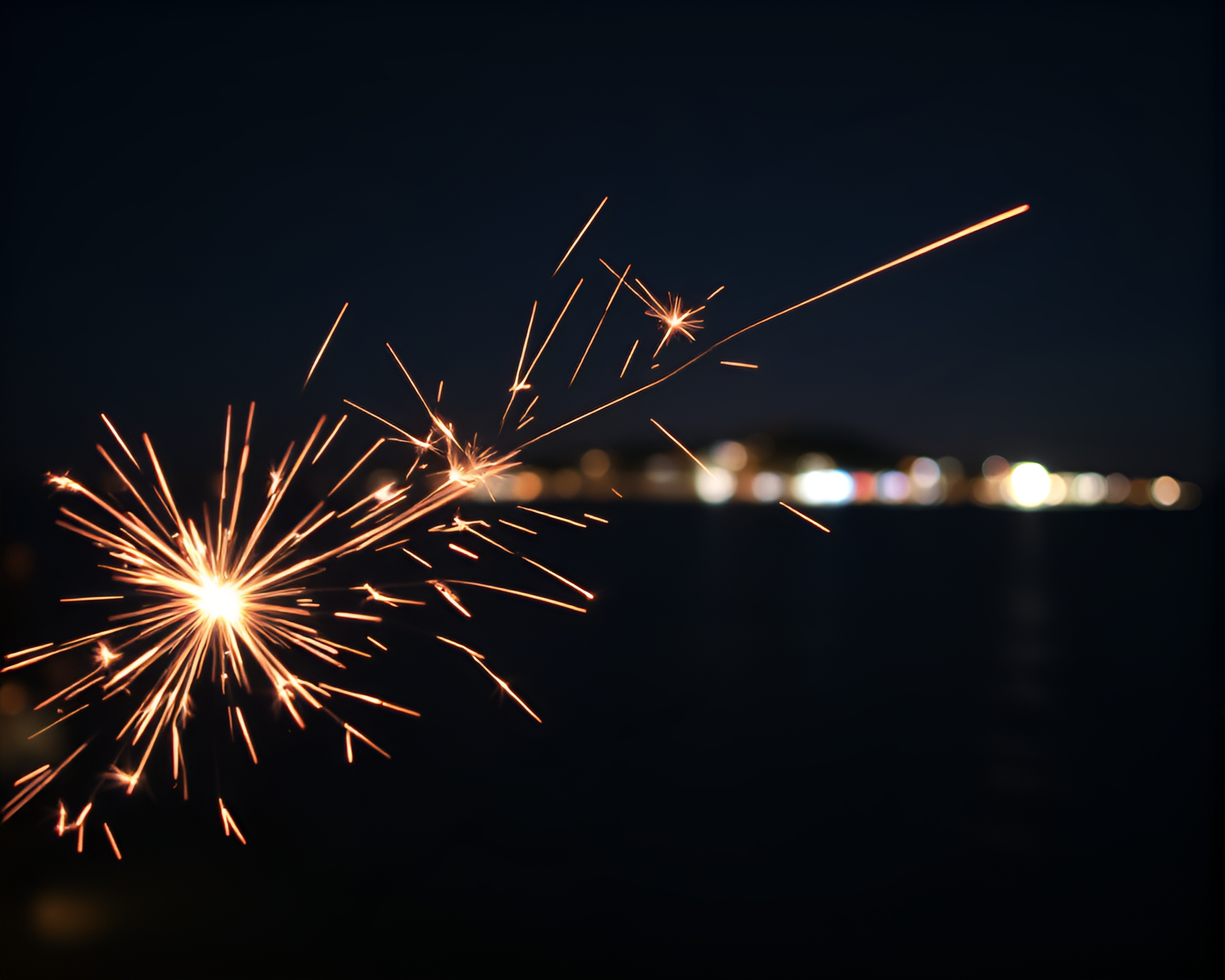 Mesmerizing Sparkler Trails on Crystal Clear Island Night – free AI stock image
