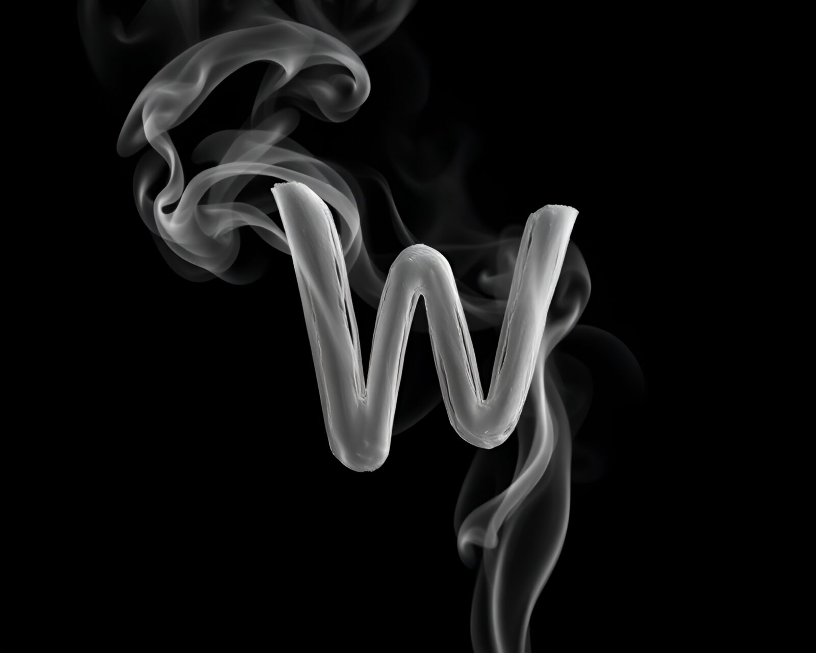 Abstract digital art depicting swirls of smoke forming a handwritten letter