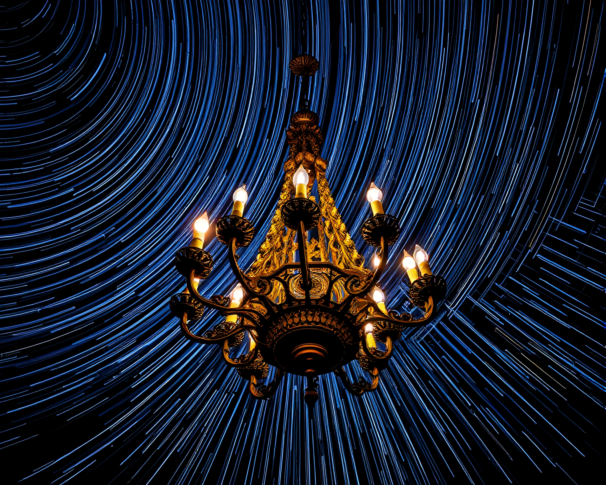 Gothic Chandelier Illuminated by Star Trails in HDR Contrast – free AI stock image