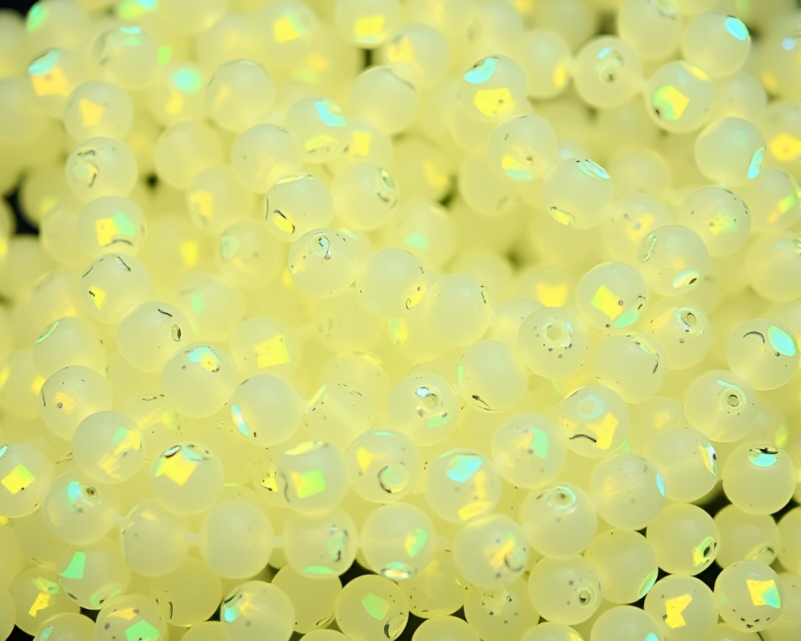 Mystical holographic texture illuminating wet glass beads in forest