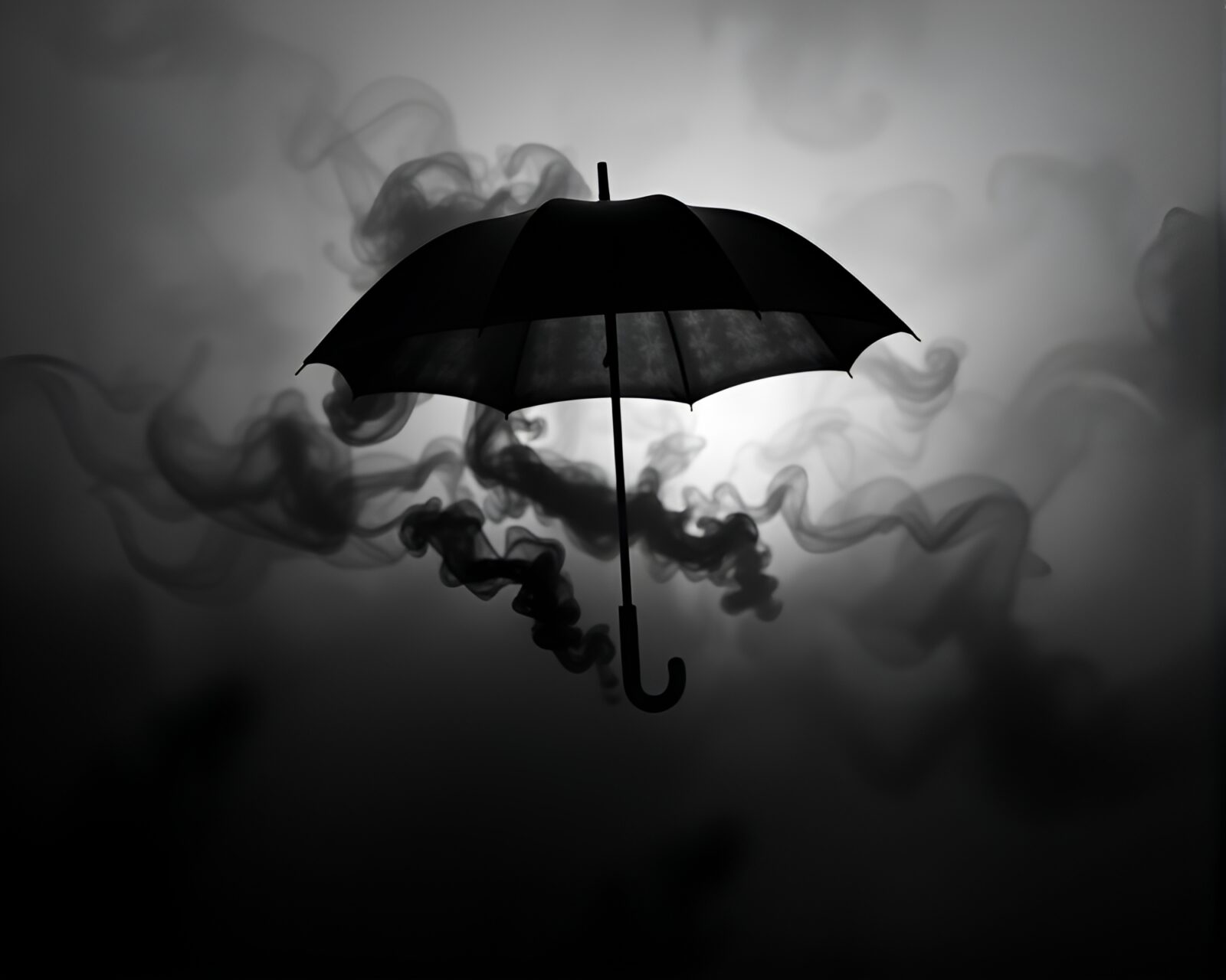 Black and white image of swirling smoke and umbrella at dawn