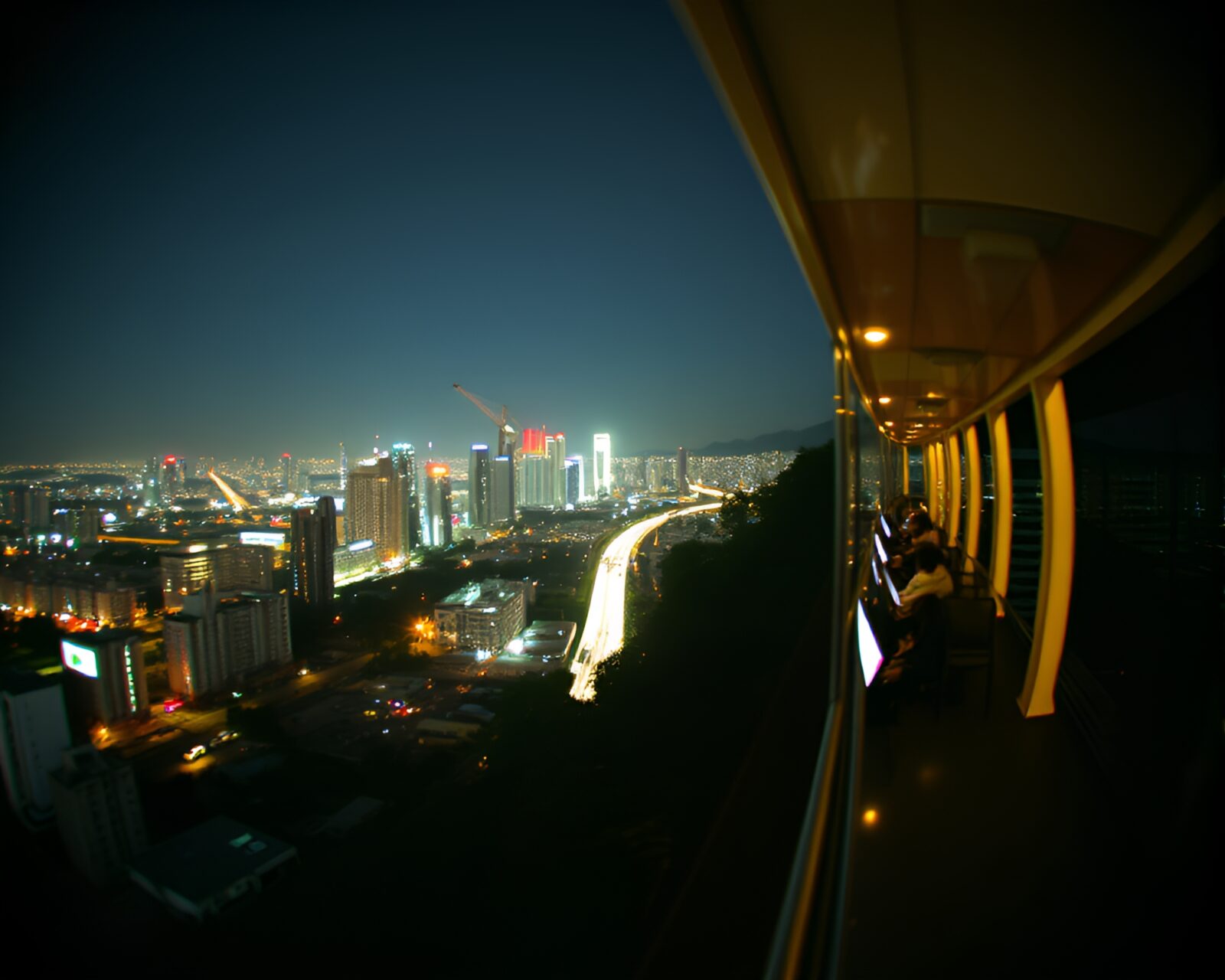 A dynamic monorail travels through a futuristic cityscape