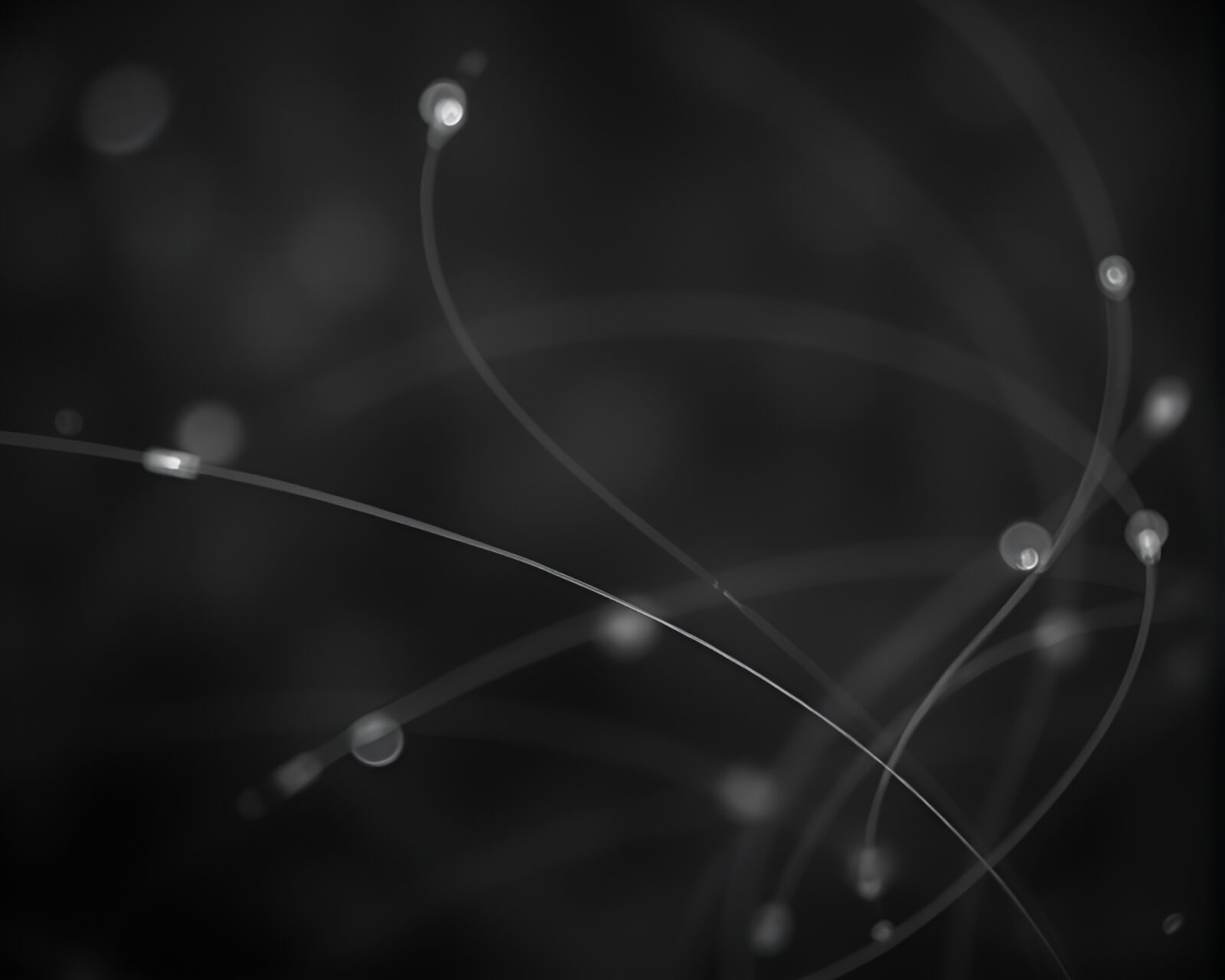 Ethereal nymph surrounded by glowing light streaks in black and white focus stacking