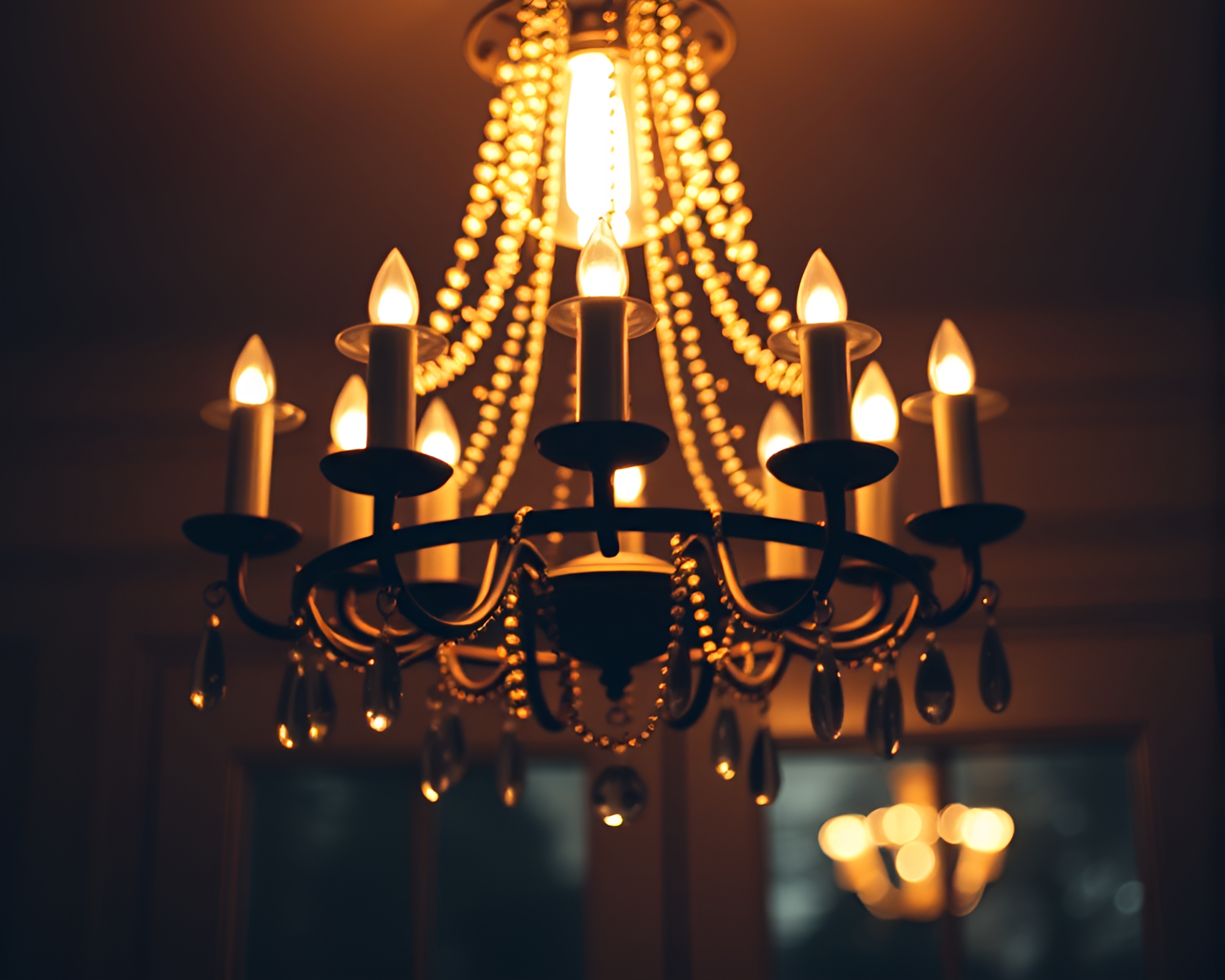 Elegant Chandelier Bathed in Porchlight Vignette – free AI stock image