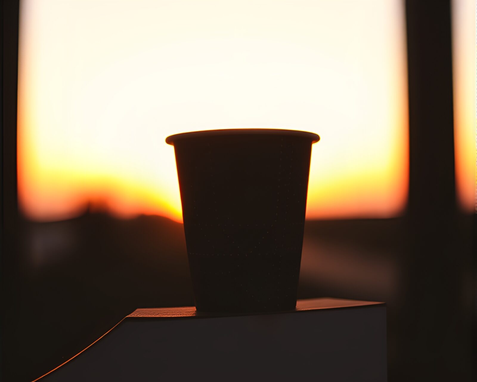 Stippled coffee cup in vibrant sunset orange hues