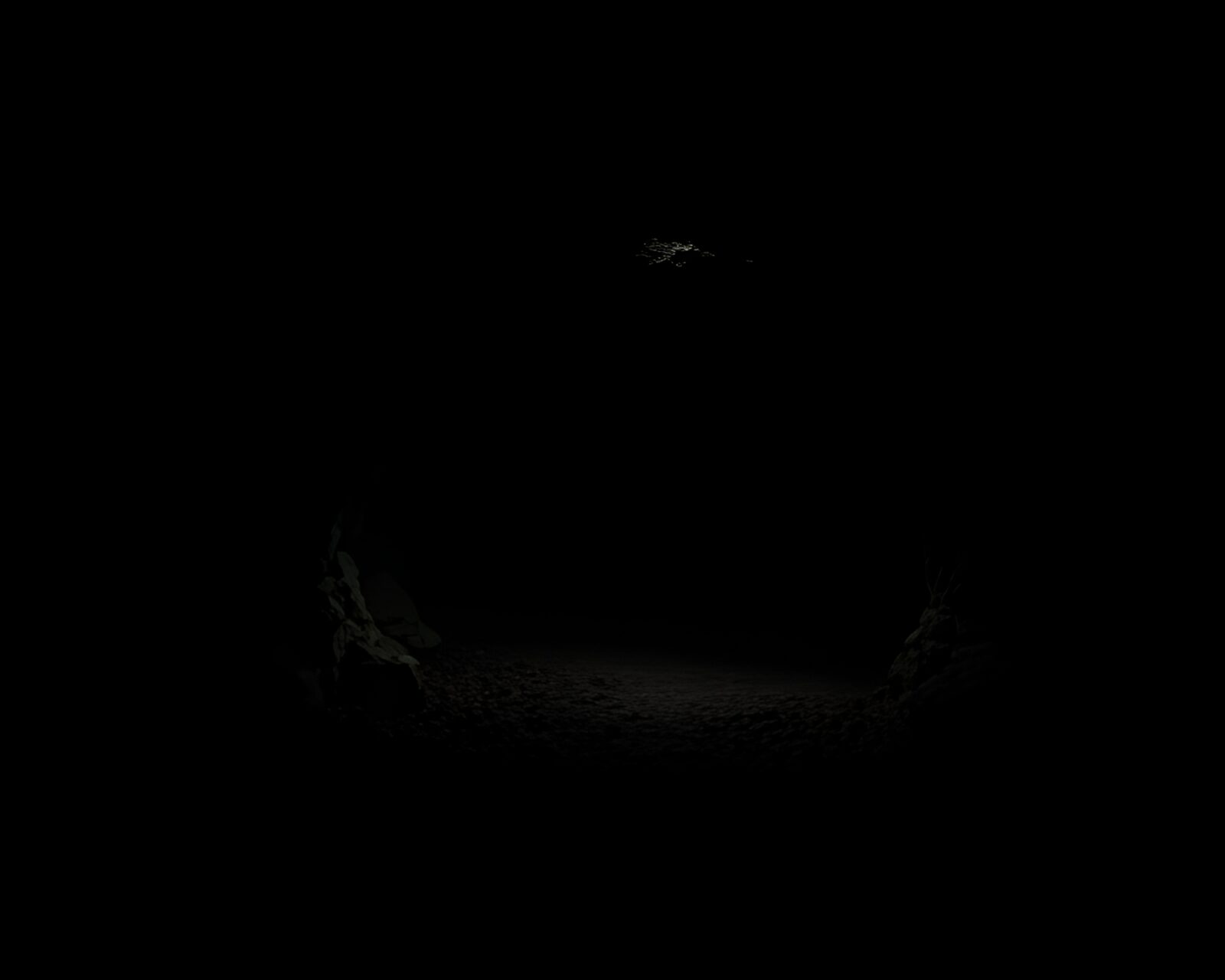 Abstract geometric patterns in dimly lit cavern entrance