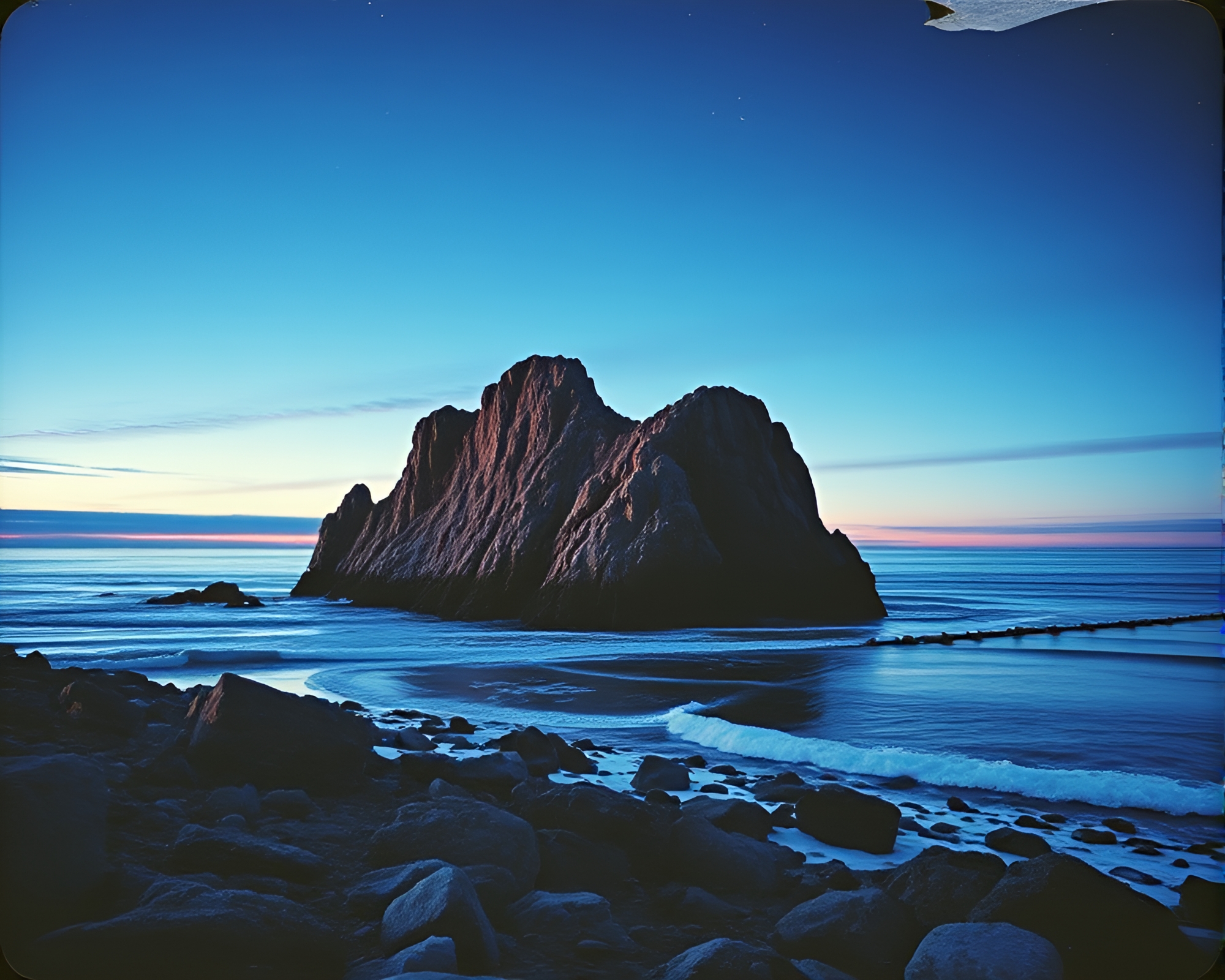 Torn Paper Twilight on Rocky Coastline – free AI stock image