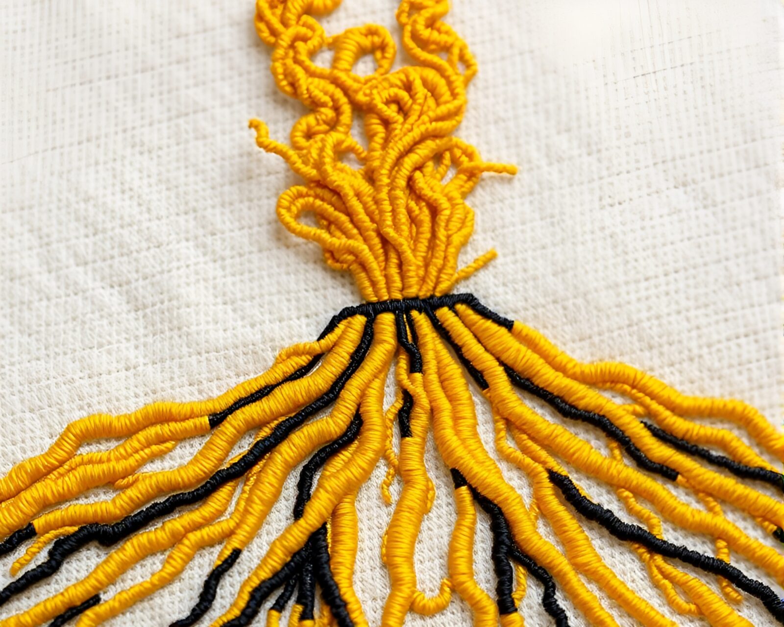 Mustard yellow pop volcanic eruption with intricate embroidery details