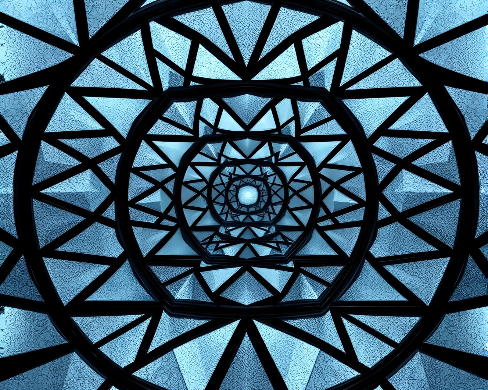Geometric patterns in faded denim layer over stained glass design