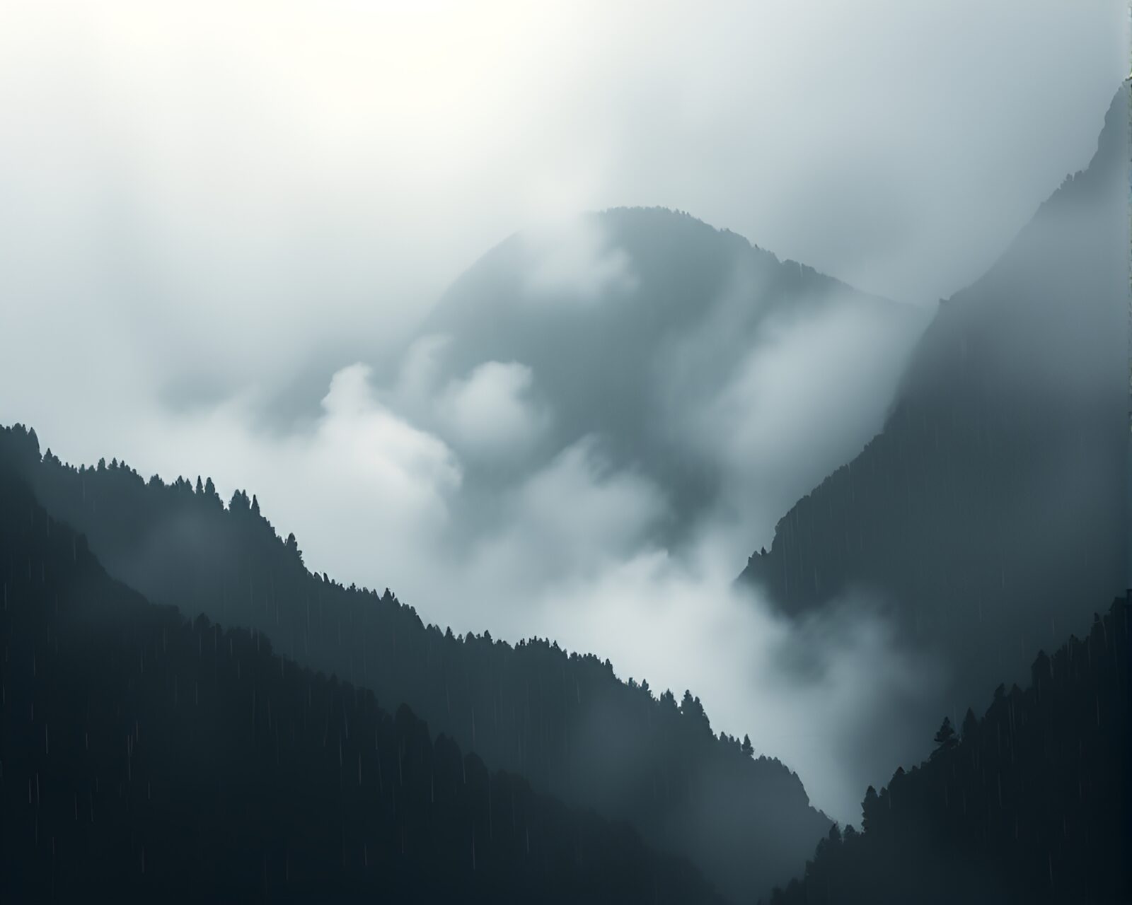 Serene scene of mountain peeking through rain and mist