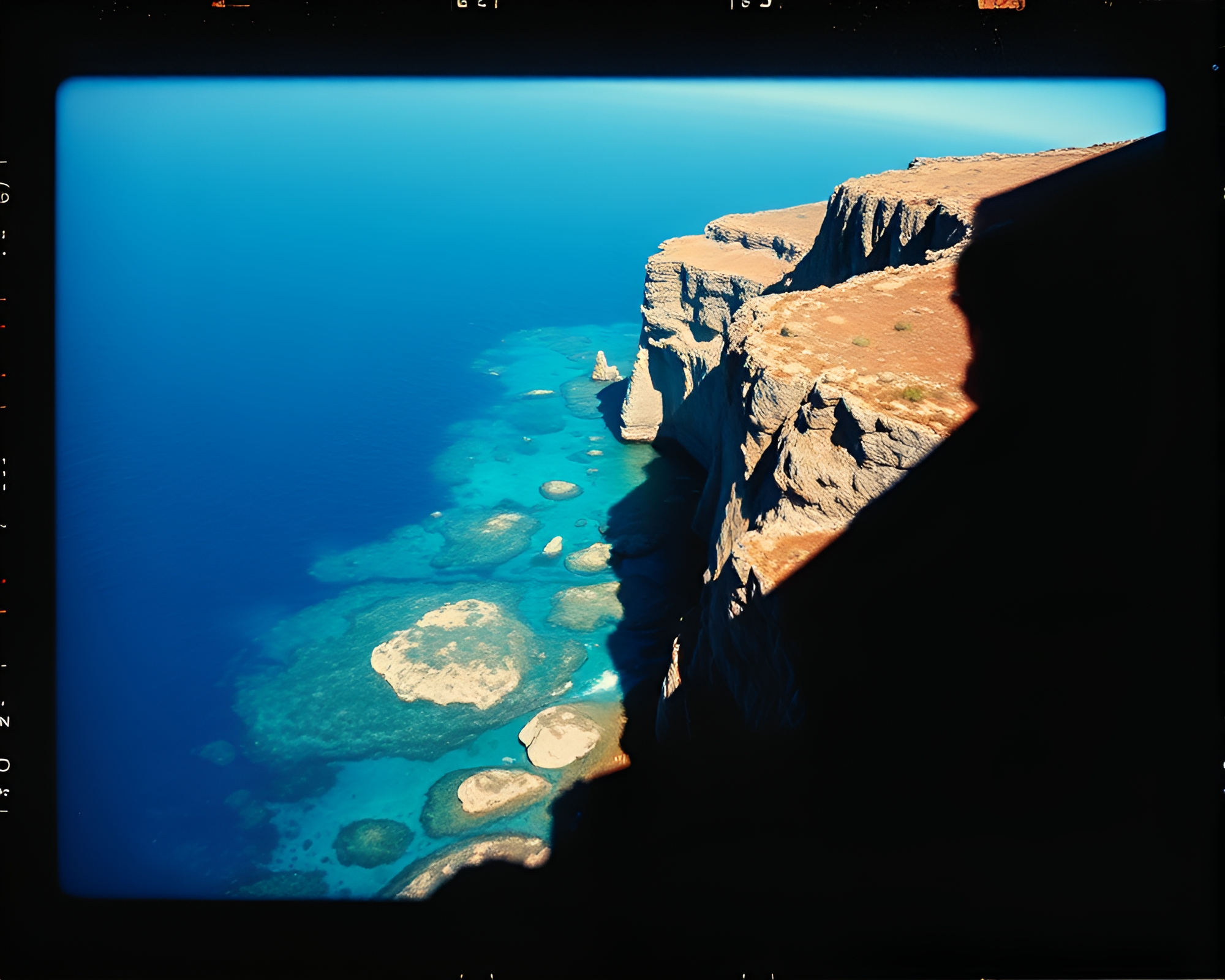 Coral Reef Sunset on Checkered Cliff Polaroid Frame – free AI stock image