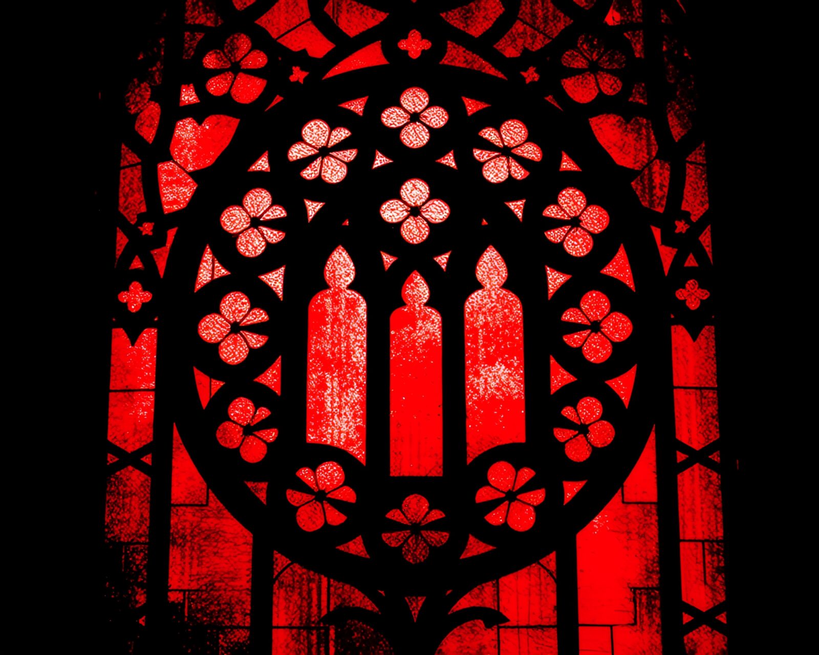 Maximalist design stained-glass window in red hues illuminating a room