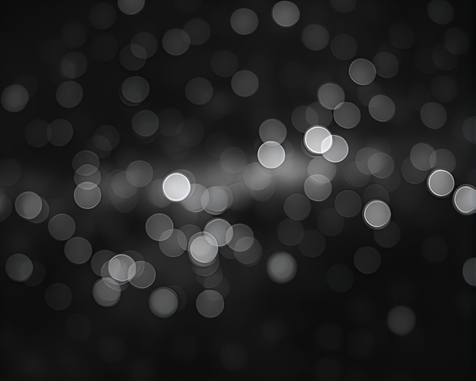 Abstract dark composition with bokeh lights and eerie figures