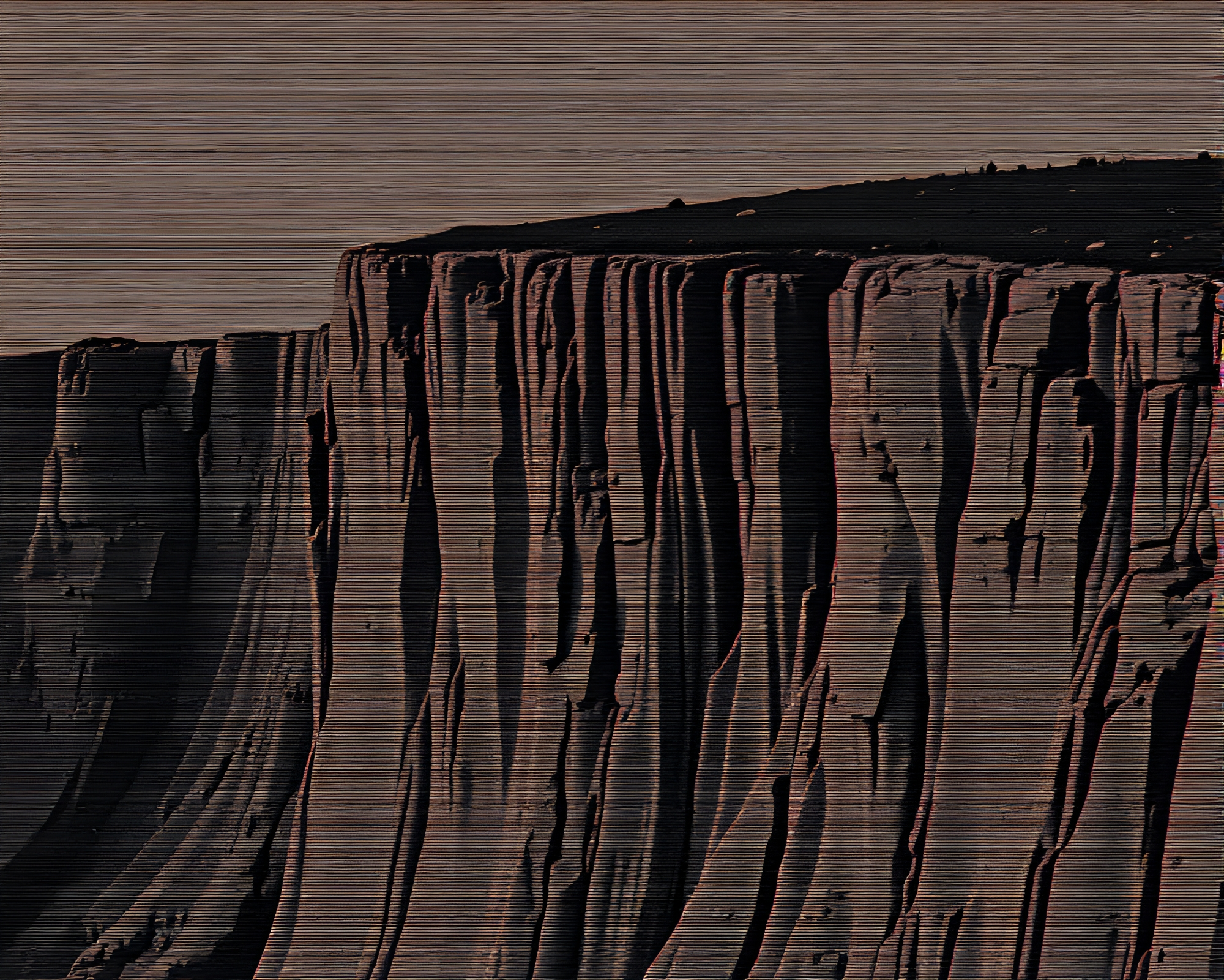 Pixelated Cliffside in Halftone Grid Film Grain – free AI stock image