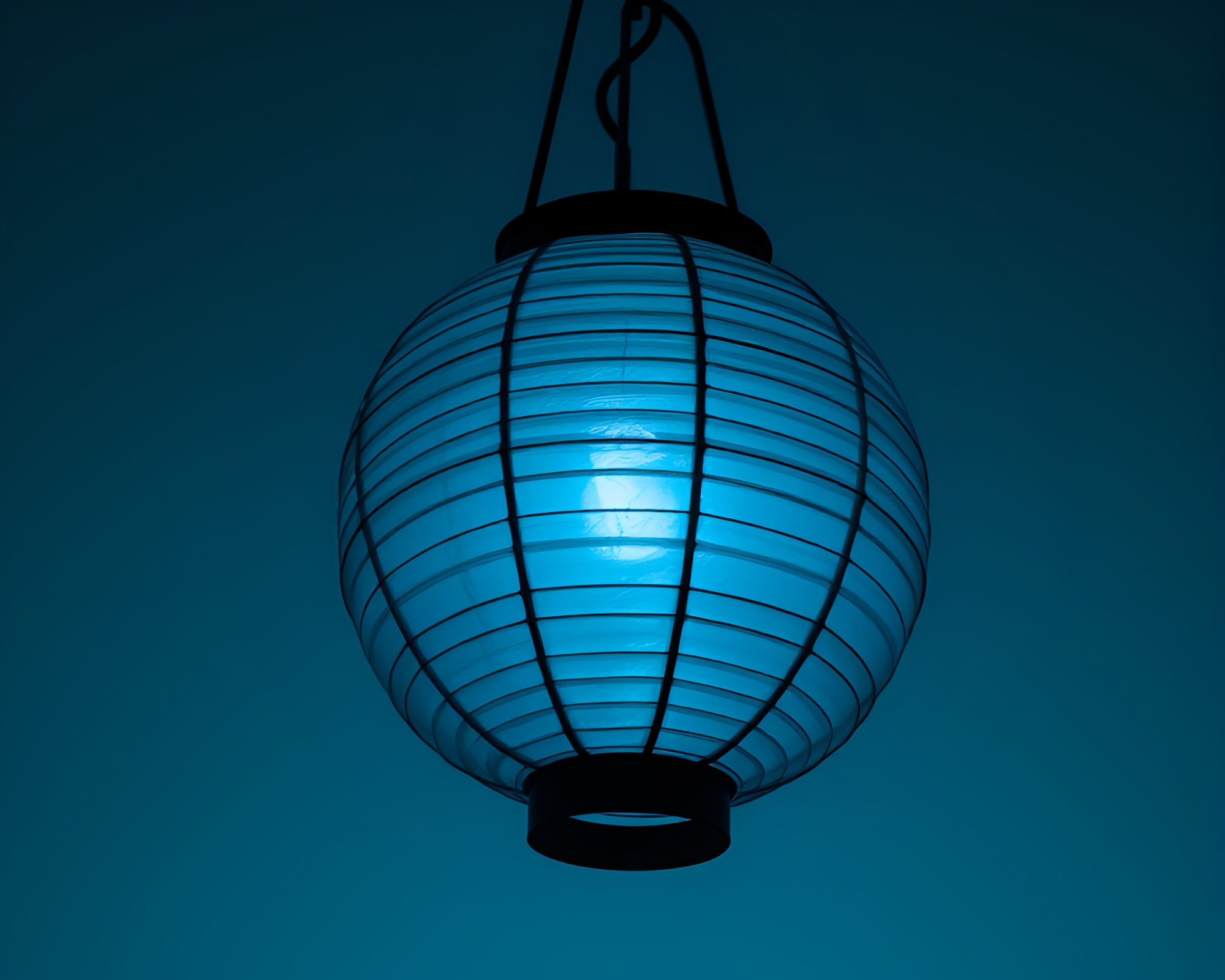 Enchanting Lantern Glow Across Monochrome Ocean Waves – free AI stock image