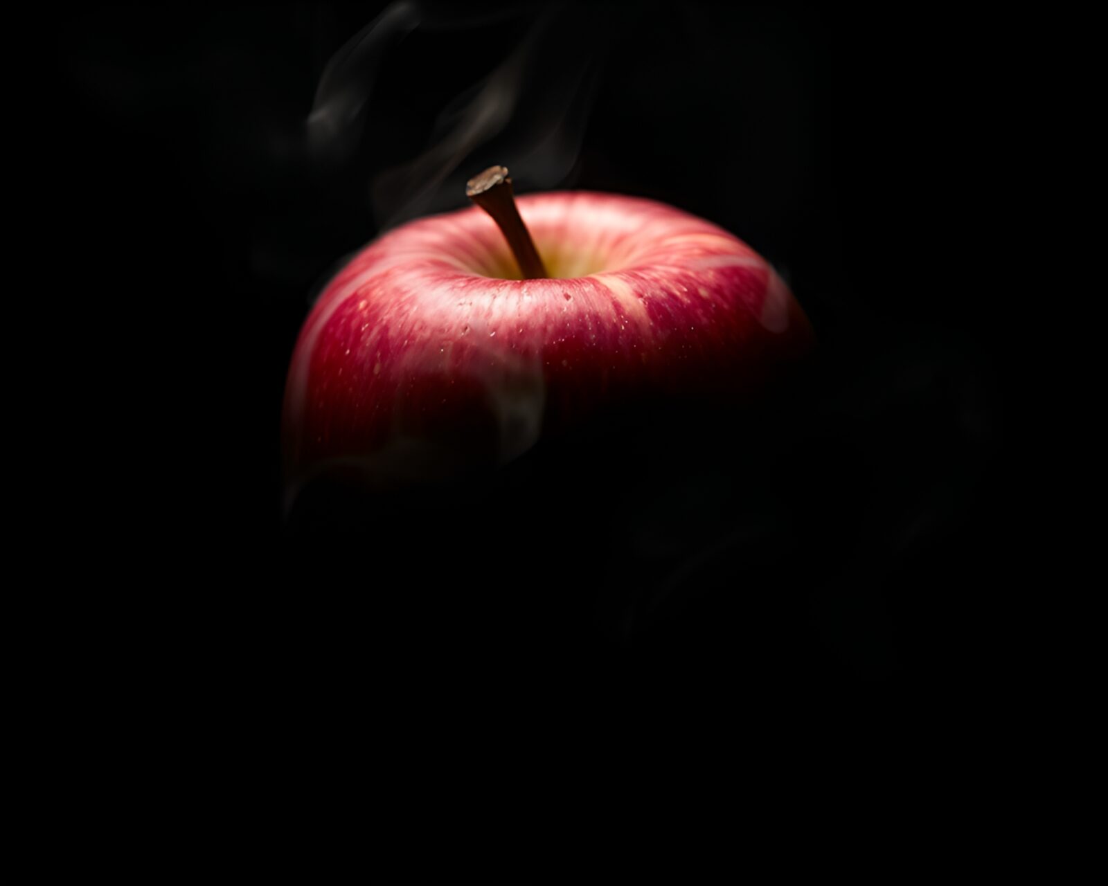 Artistic charcoal drawing of apple cider highlighted in low light