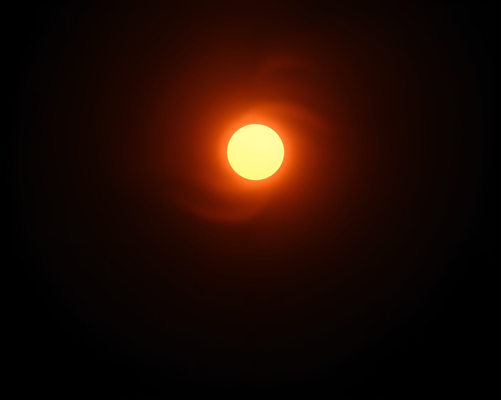 High-angle blueprint-style image of a solar eclipse in candlelit ambiance