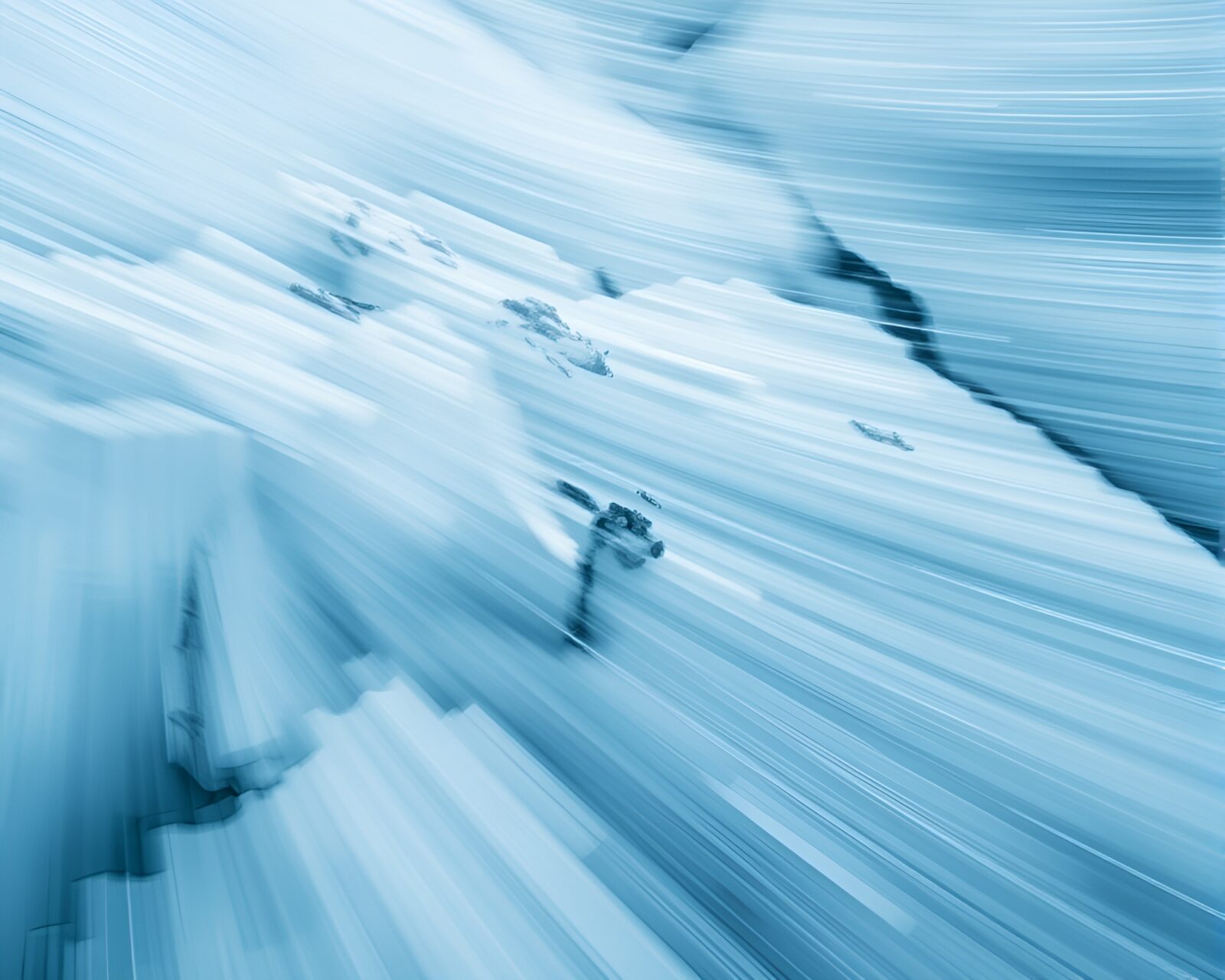 Macro photography of monochrome blue glacier with motion blur streaks