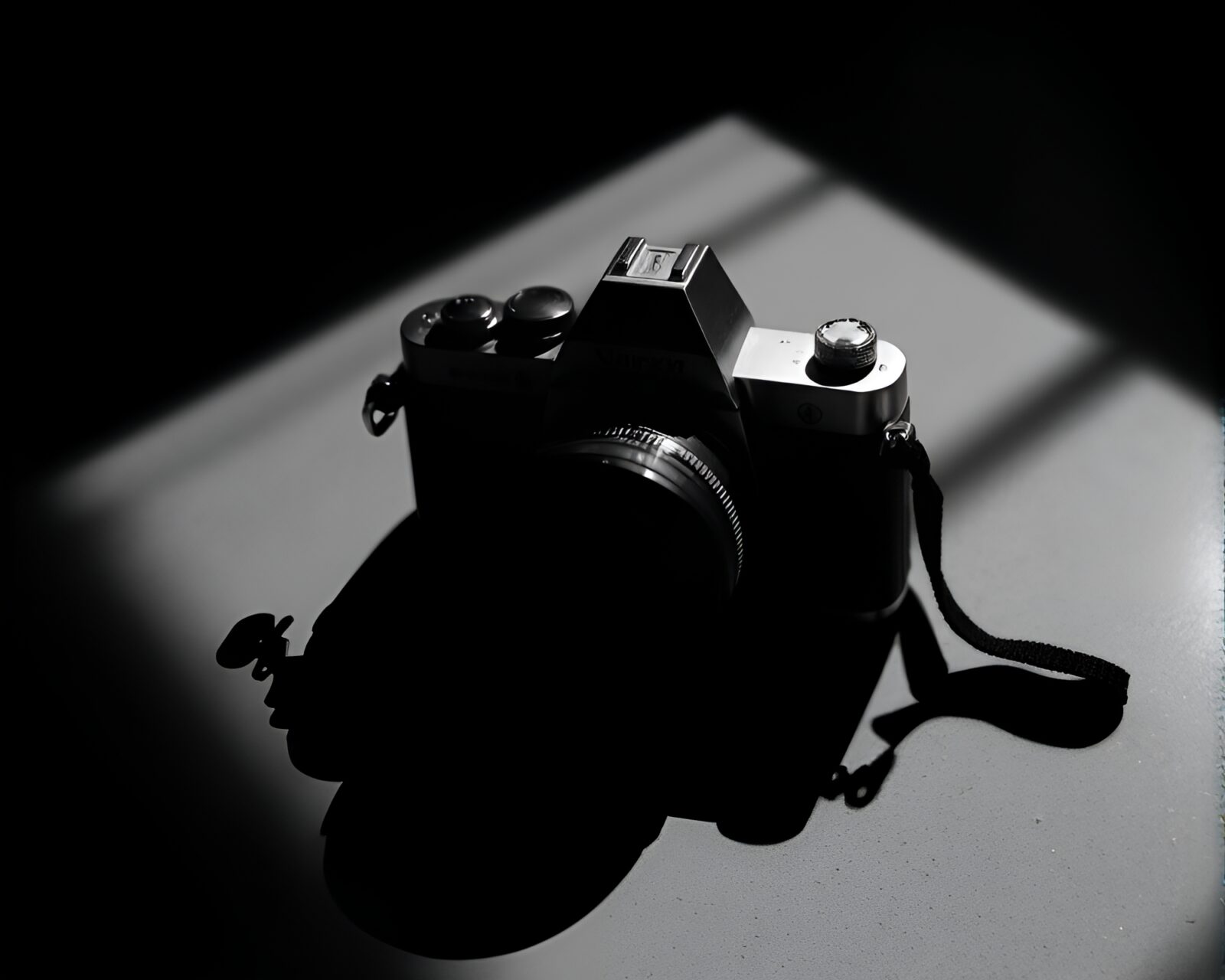 Chiaroscuro composition: camera reflecting muted shadows in scene